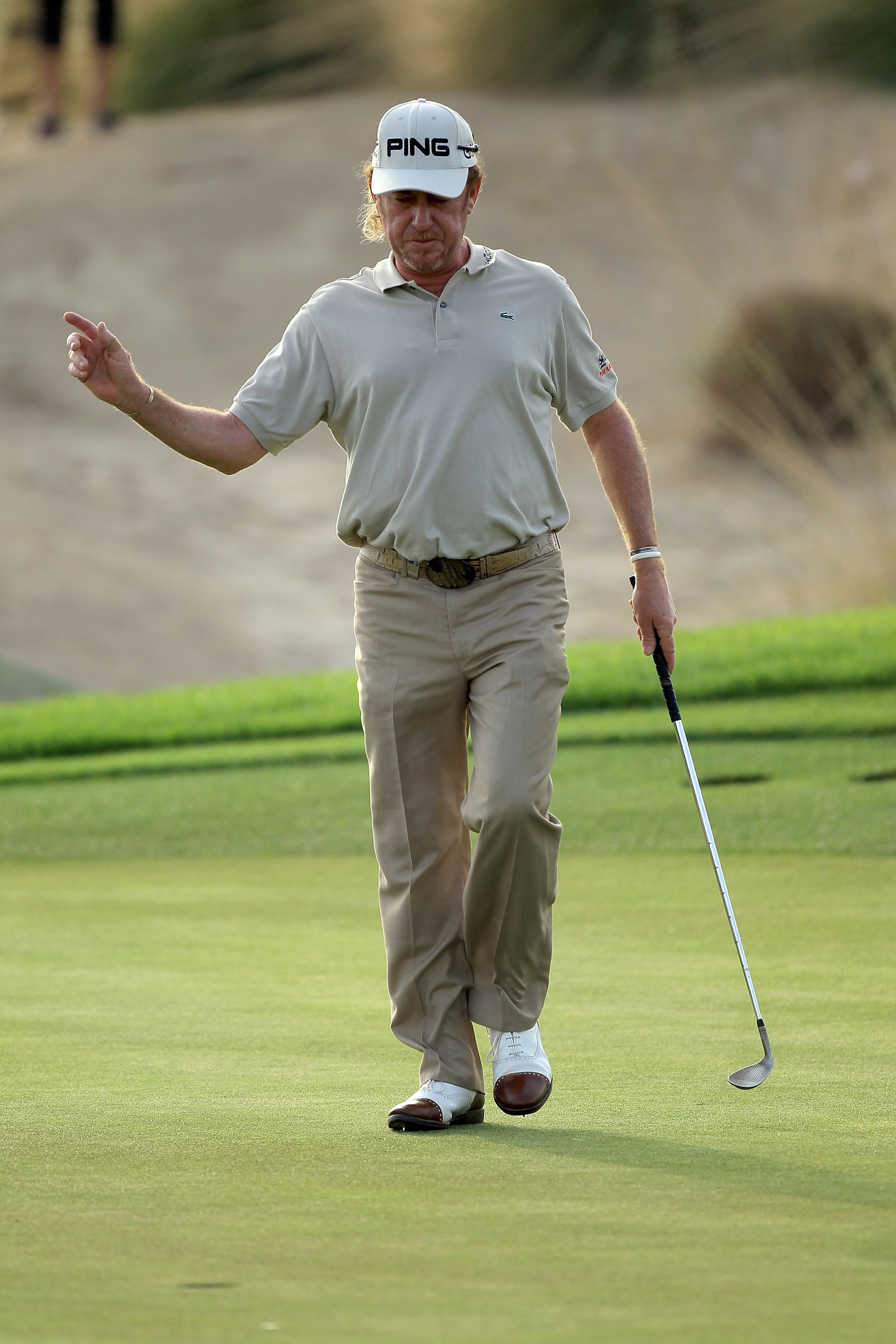 BAHRAIN, BAHRAIN - JANUARY 28:  Miguel Angel Jimenez of Spain putting with his wedge for birdie on the 15th hole after he had broken his putter on a previous hole during the second round of the 2011 Volvo Champions held at the Royal Golf Club on January 2