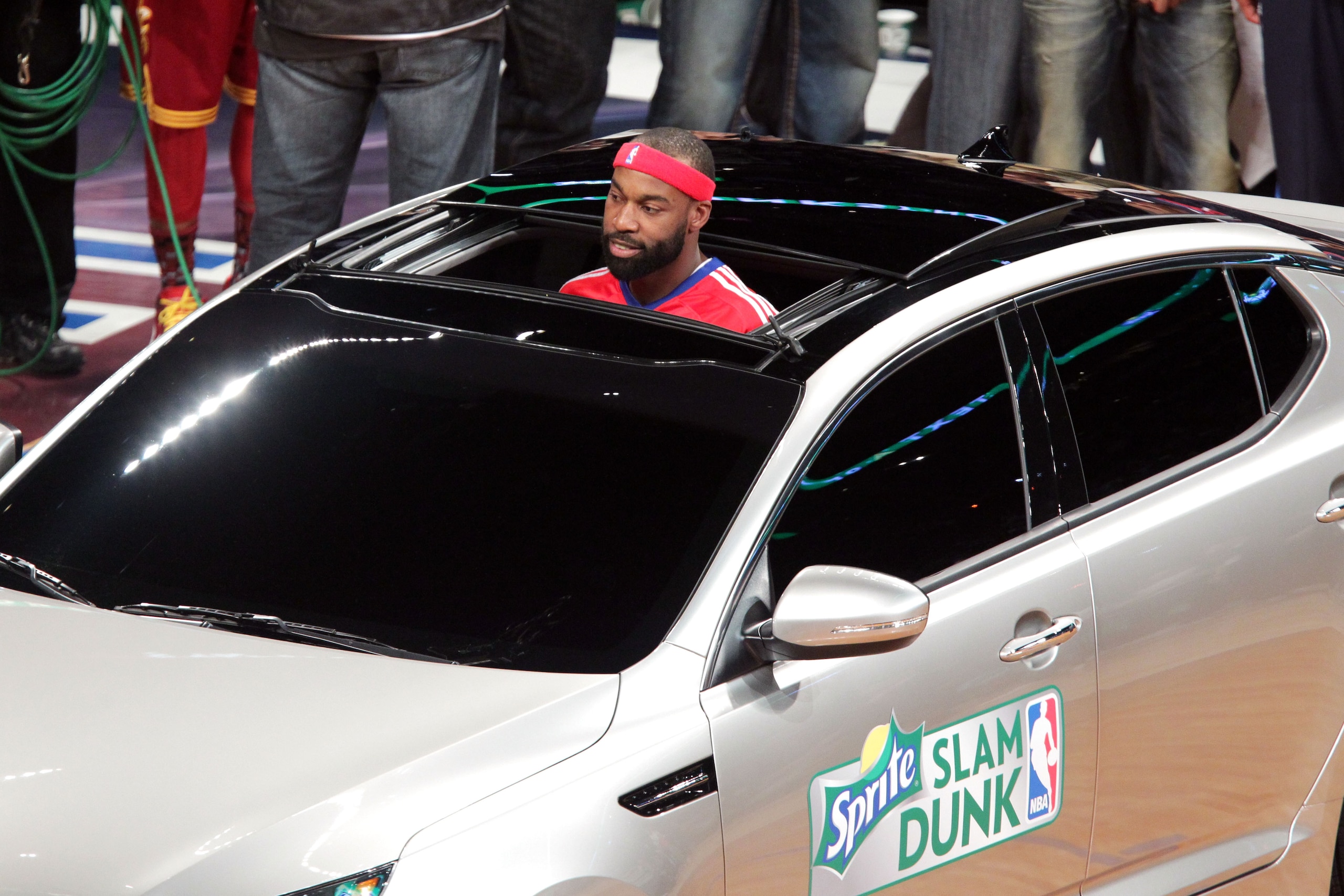 LOS ANGELES, CA - FEBRUARY 19:  NBA player Baron Davis of the L.A. Clippers passes the ball from inside the car to teammate, Blake Griffin, and he attempts a slam dunk, during the Sprite Slam Dunk Contest apart of NBA All-Star Saturday Night at Staples Ce