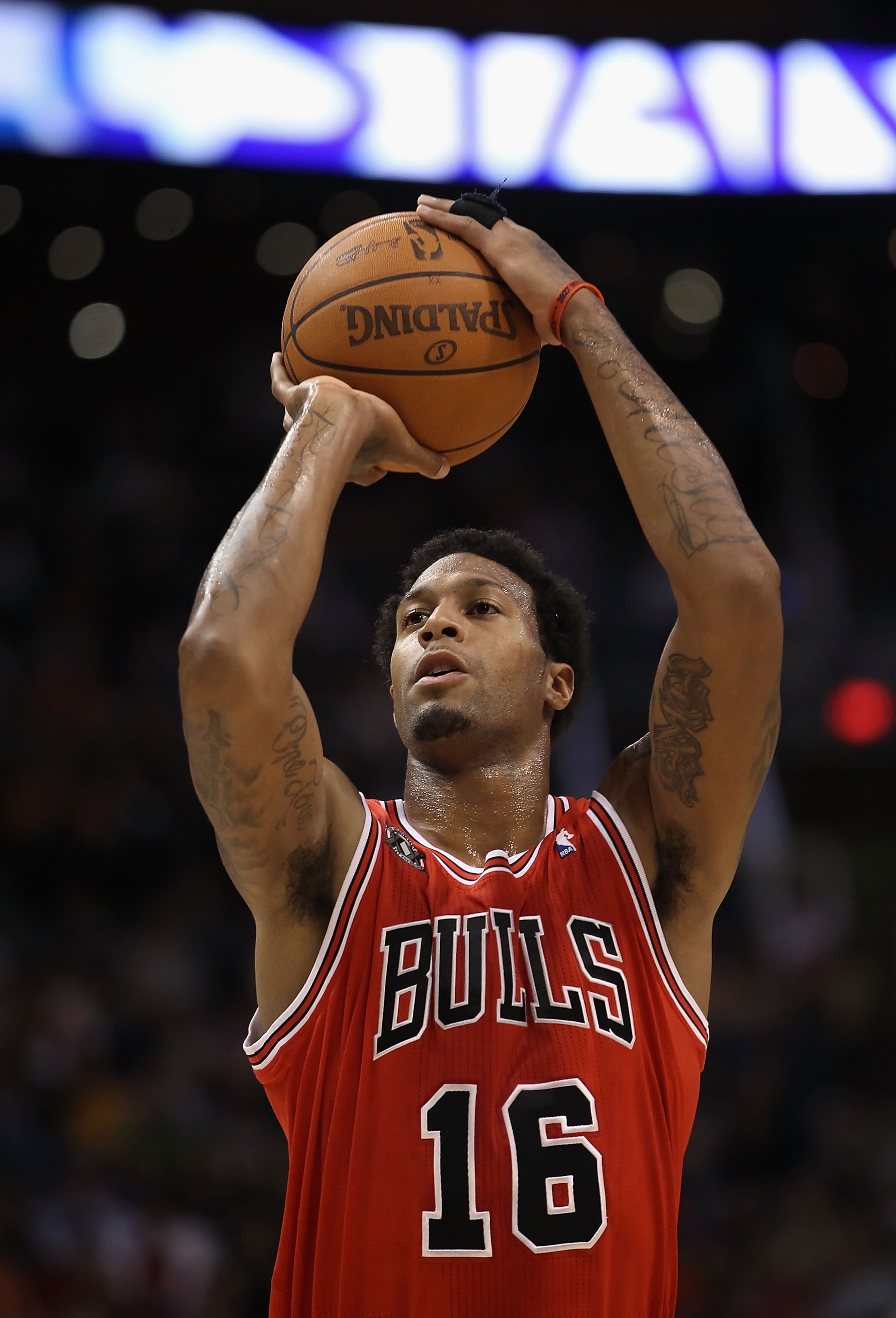 PHOENIX - NOVEMBER 24:  James Johnson #19 of the Chicago Bulls shoots a free throw shot during the NBA game against the Phoenix Suns at US Airways Center on November 24, 2010 in Phoenix, Arizona. The Bulls defeated the Suns 123-115 in double overtime. NOT