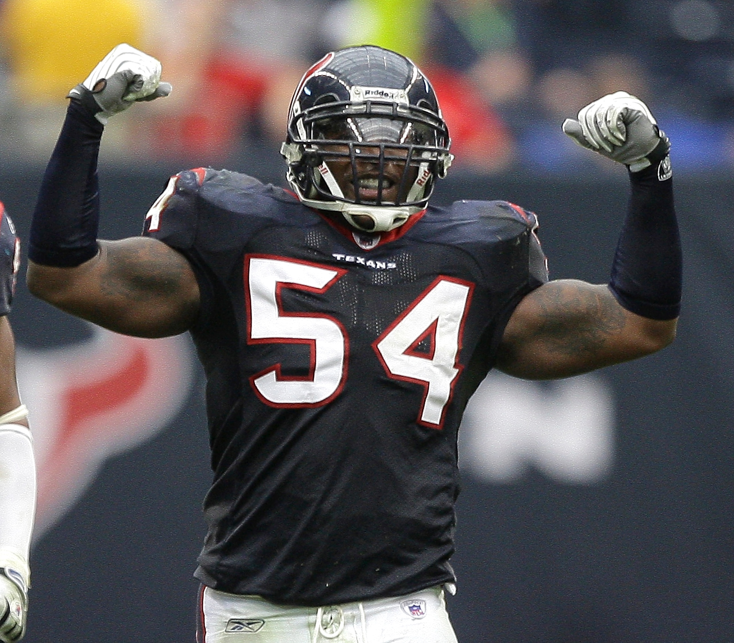 HOUSTON - DECEMBER 13:  Linebacker Zac Diles #54 of the Houston Texans celebrate after a defensive stop against the Seattle Seahawks at Reliant Stadium on December 13, 2009 in Houston, Texas. The Texans won 34-7. (Photo by Bob Levey/Getty Images)