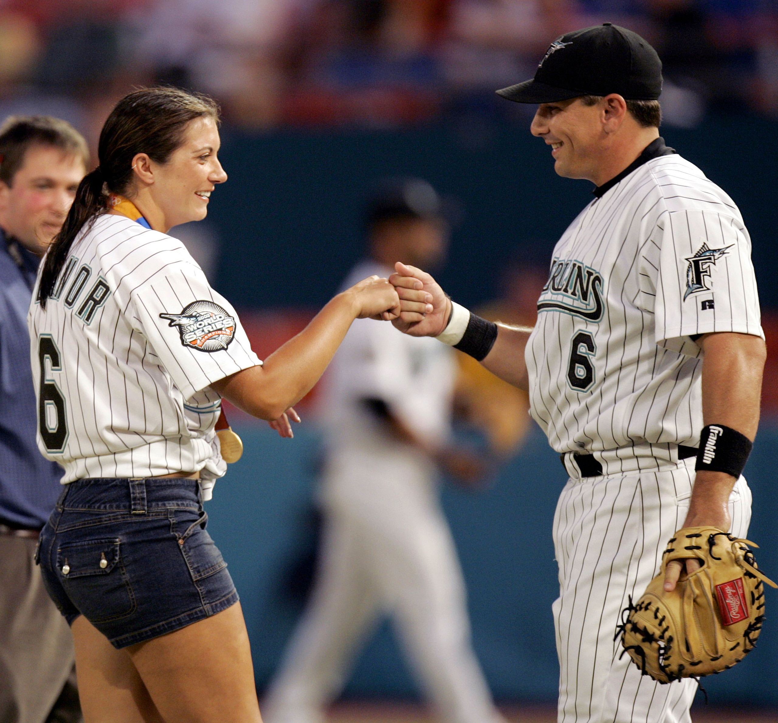MIAMI - SEPTEMBER 17: Olympic Gold Medalist in Beach Volleyball, Misty May, is greeted by her fiancee, Matt Treanor #6 of the Florida Marlins, after throwing the ritual first pitch before the start of the Florida Marlins against the Atlanta Braves on Sep MIAMI - SEPTEMBER 17: Olympic Gold Medalist in Beach Volleyball, Misty May, is greeted by her fiancee, Matt Treanor #6 of the Florida Marlins, after throwing the ritual first pitch before the start of the Florida Marlins against the Atlanta Braves on Sep