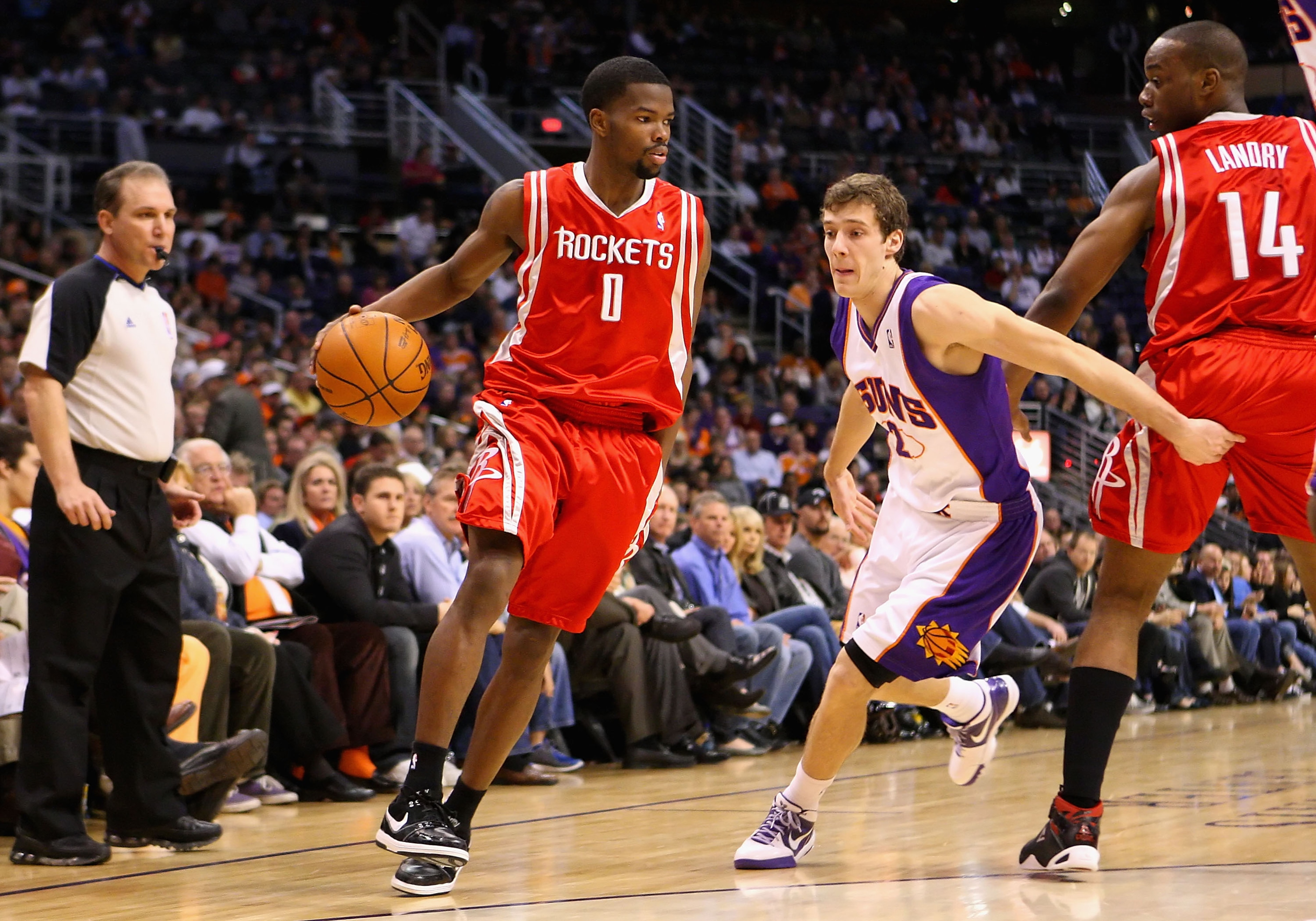 PHOENIX - JANUARY 06:  Aaron Brooks #1 of the Houston Rockets drives the ball past Goran Dragic #2 of the Phoenix Suns during the NBA game at US Airways Center on January 6, 2010 in Phoenix, Arizona. NOTE TO USER: User expressly acknowledges and agrees th