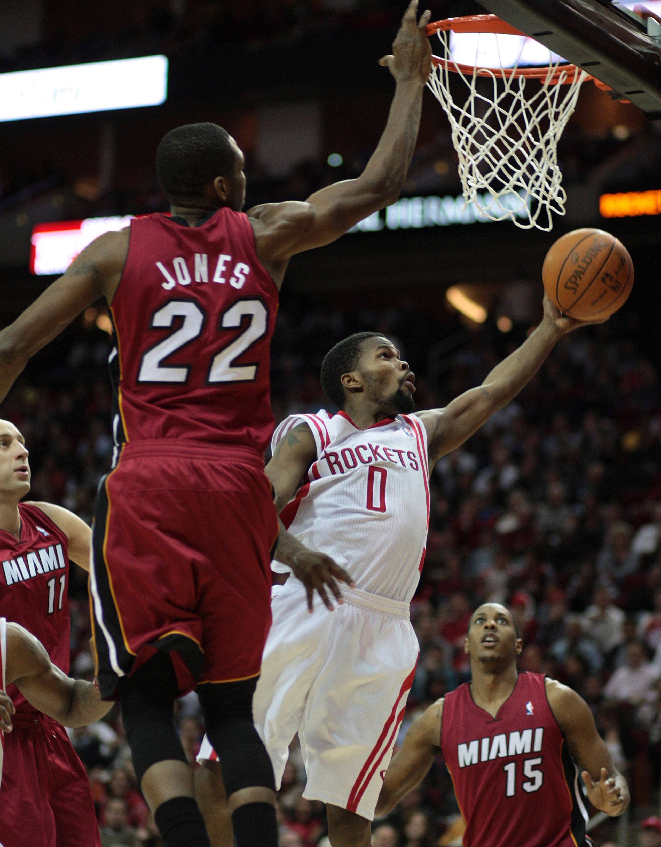 HOUSTON - DECEMBER 29: Aaron Brooks #0 of the Houston Rockets drives to the basket past James Jones #22 of the Miami Heat at Toyota Center on December 29, 2010 in Houston, Texas.  (Photo by Bob Levey/Getty Images)