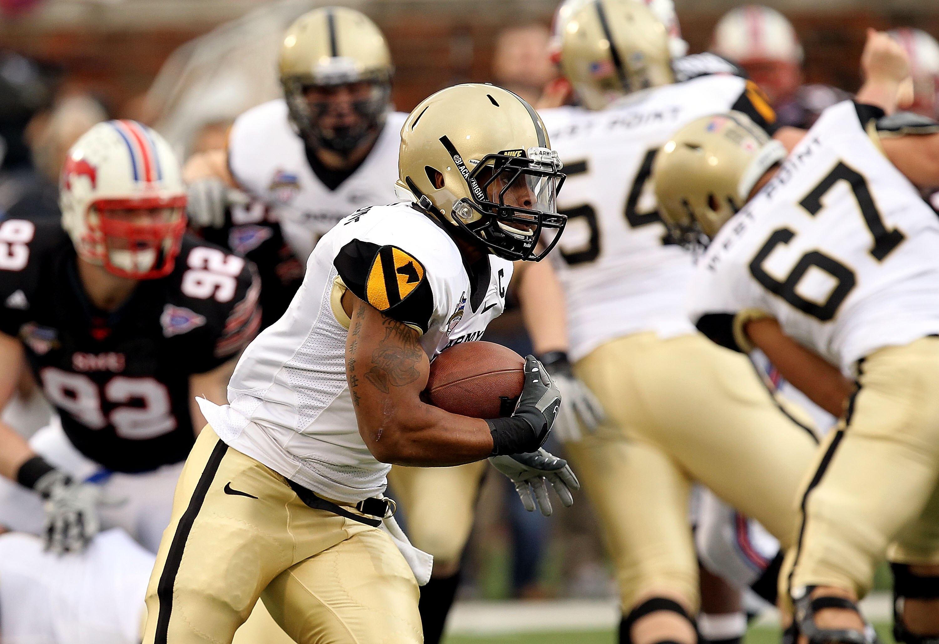 DALLAS, TX - DECEMBER 30:  Running back Patrick Mealy #5 of the Army Black Knights runs the ball against the SMU Mustanges during the Bell Helicopter Armed Forces Bowl at Gerald J. Ford Stadium on December 30, 2010 in Dallas, Texas.  (Photo by Ronald Mart