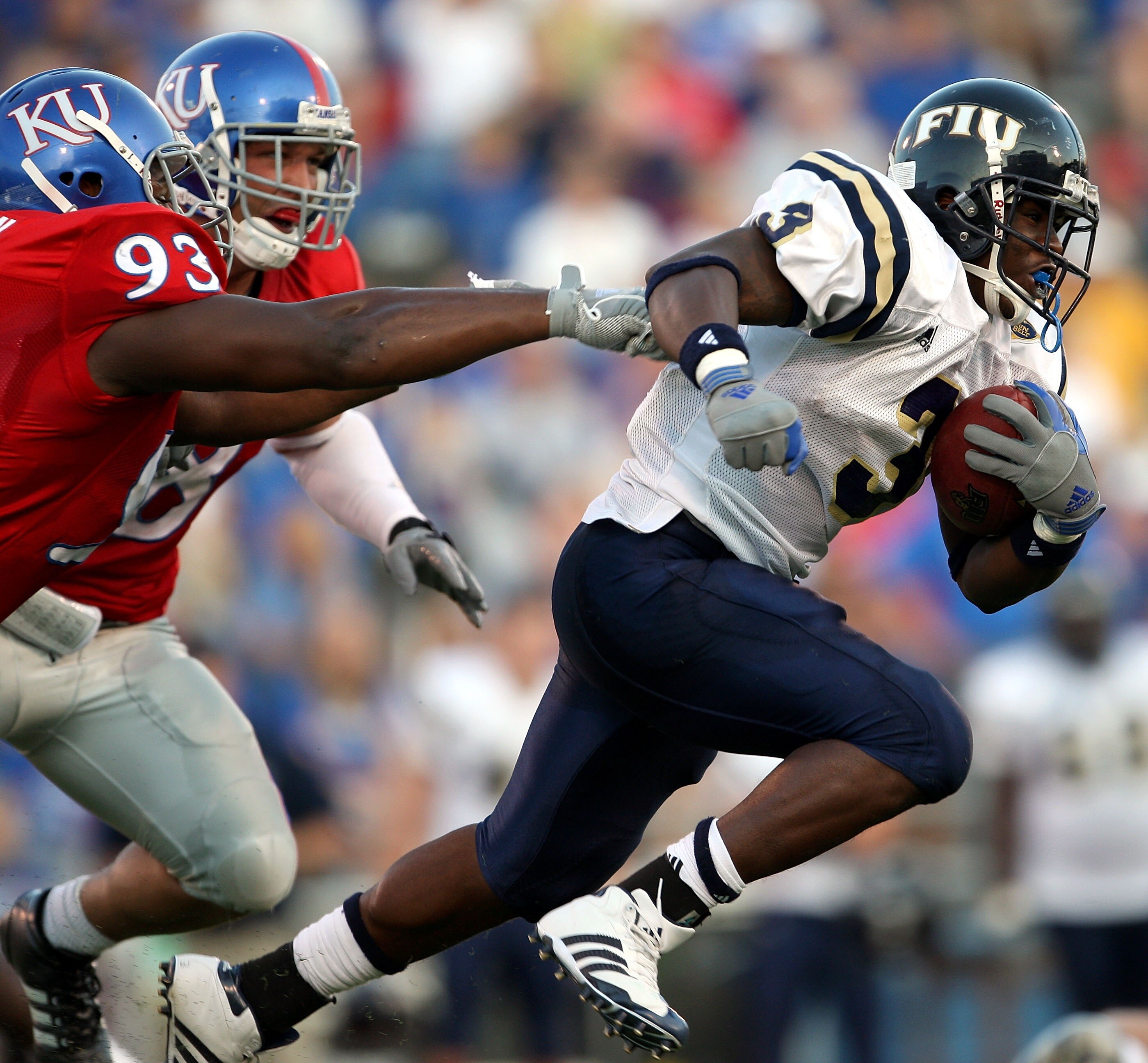 LAWRENCE, KS - SEPTEMBER 22:  A'mod Ned #3 of the Florida International Golden Panthers carries the ball as James McClinton #93 of the Kansas Jayhawks gives chase during the game on September 22, 2007 at Memorial Stadium in Lawrence, Kansas.  (Photo by Ja
