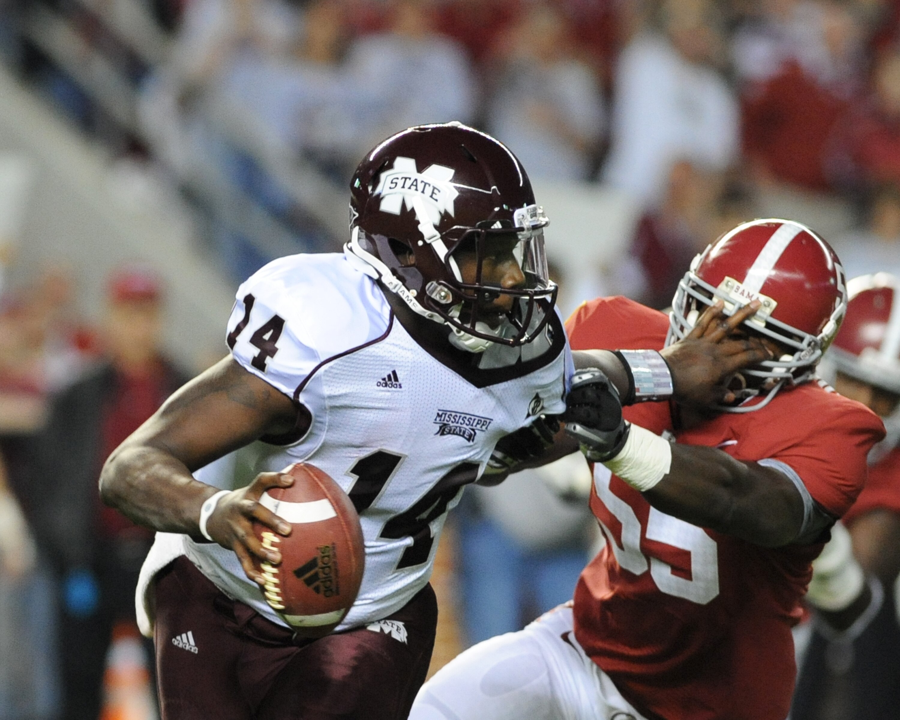 TUSCALOOSA, AL - NOVEMBER 13: Quarterback Chris Reif #14 of the Mississippi State Bulldogs rushes upfield against the Alabama Crimson Tide November 13, 2010 at Bryant-Denny Stadium in Tuscaloosa, Alabama.  (Photo by Al Messerschmidt/Getty Images)