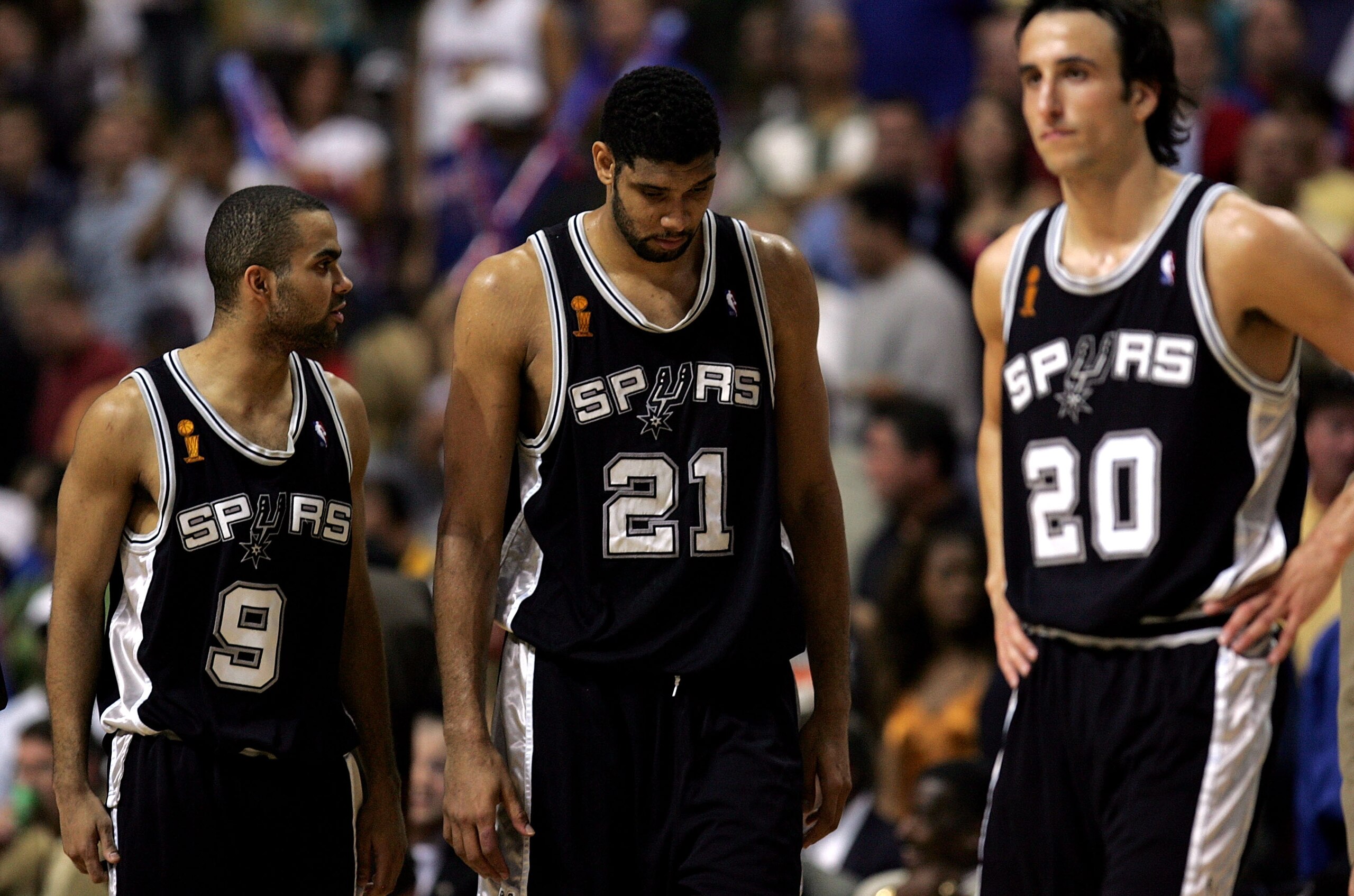 AUBURN HILLS, MI - JUNE 19:  (L-R) Tony Parker #9, Tim Duncan #21 and Manu Ginobili #20 of the San Antonio Spurs wait for the start of overtime against the Detroit Pistons in Game five of the 2005 NBA Finals at The Palace of Auburn Hills on June 19, 2005