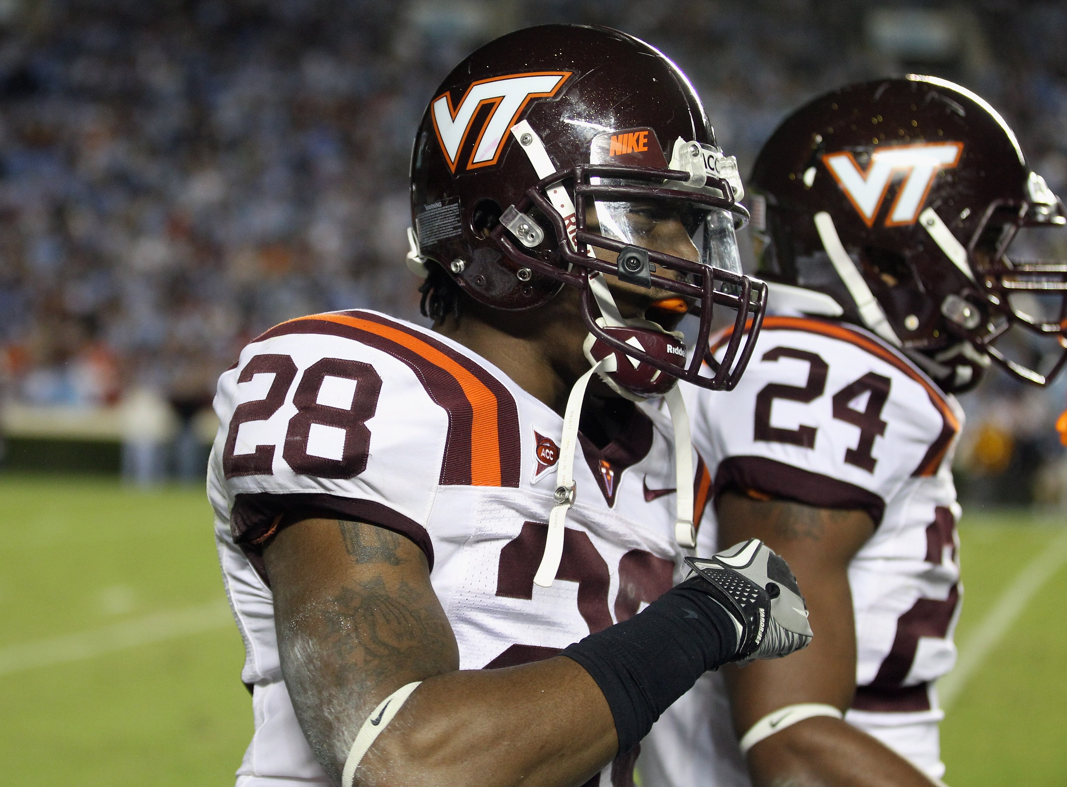 CHAPEL HILL, NC - NOVEMBER 13:  Alonzo Tweedy #28 of the Virginia Tech Hokies celebrates with teammates after recovering a fumble against the North Carolina Tar Heels during their game at Kenan Stadium on November 13, 2010 in Chapel Hill, North Carolina. 