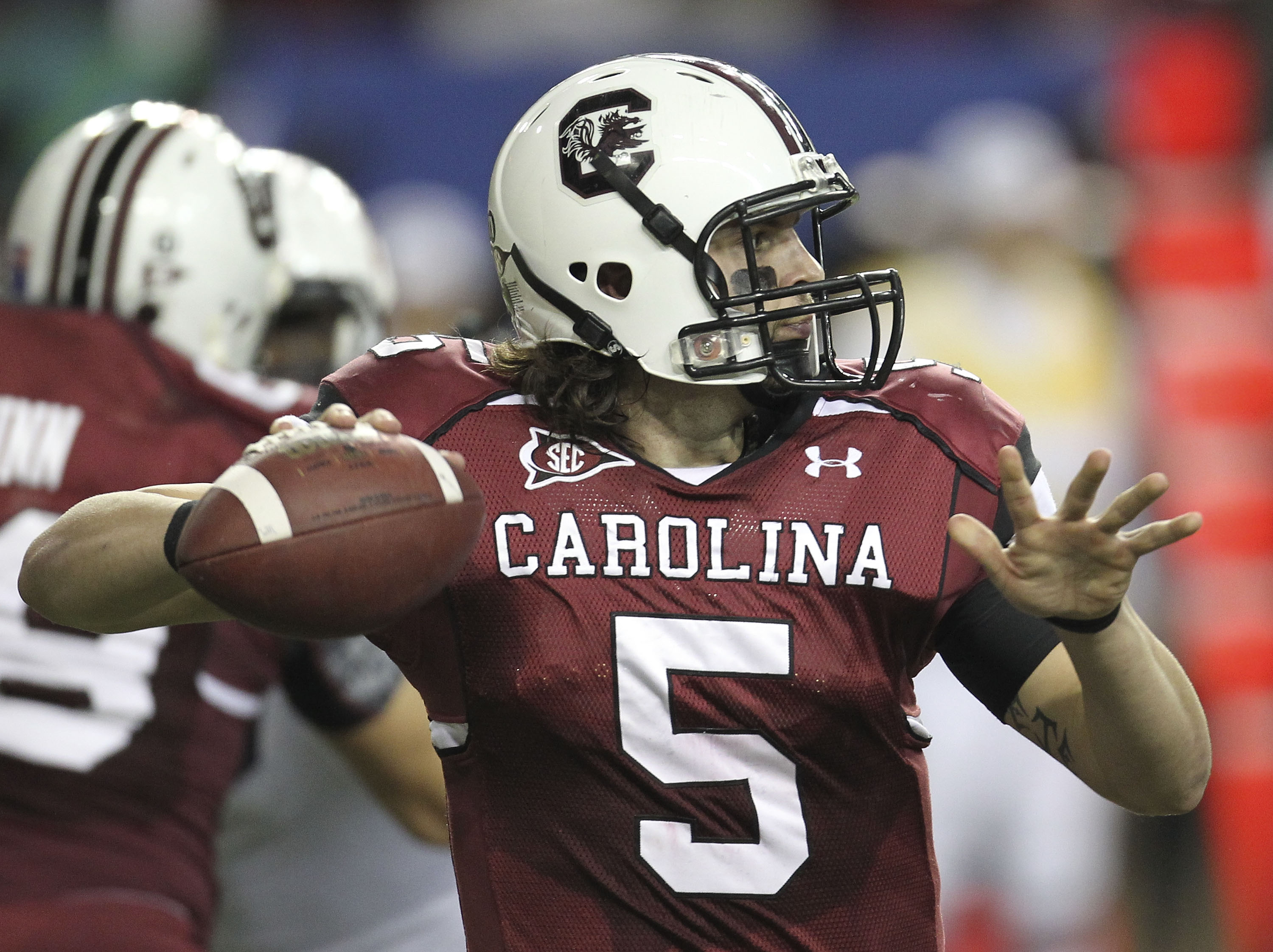 ATLANTA - DECEMBER 04:  Quarterback Stephen Garcia #5 of the South Carolina Gamecocks throws a pass during the 2010 SEC Championship against the Auburn Tigers at Georgia Dome on December 4, 2010 in Atlanta, Georgia.  (Photo by Mike Zarrilli/Getty Images)