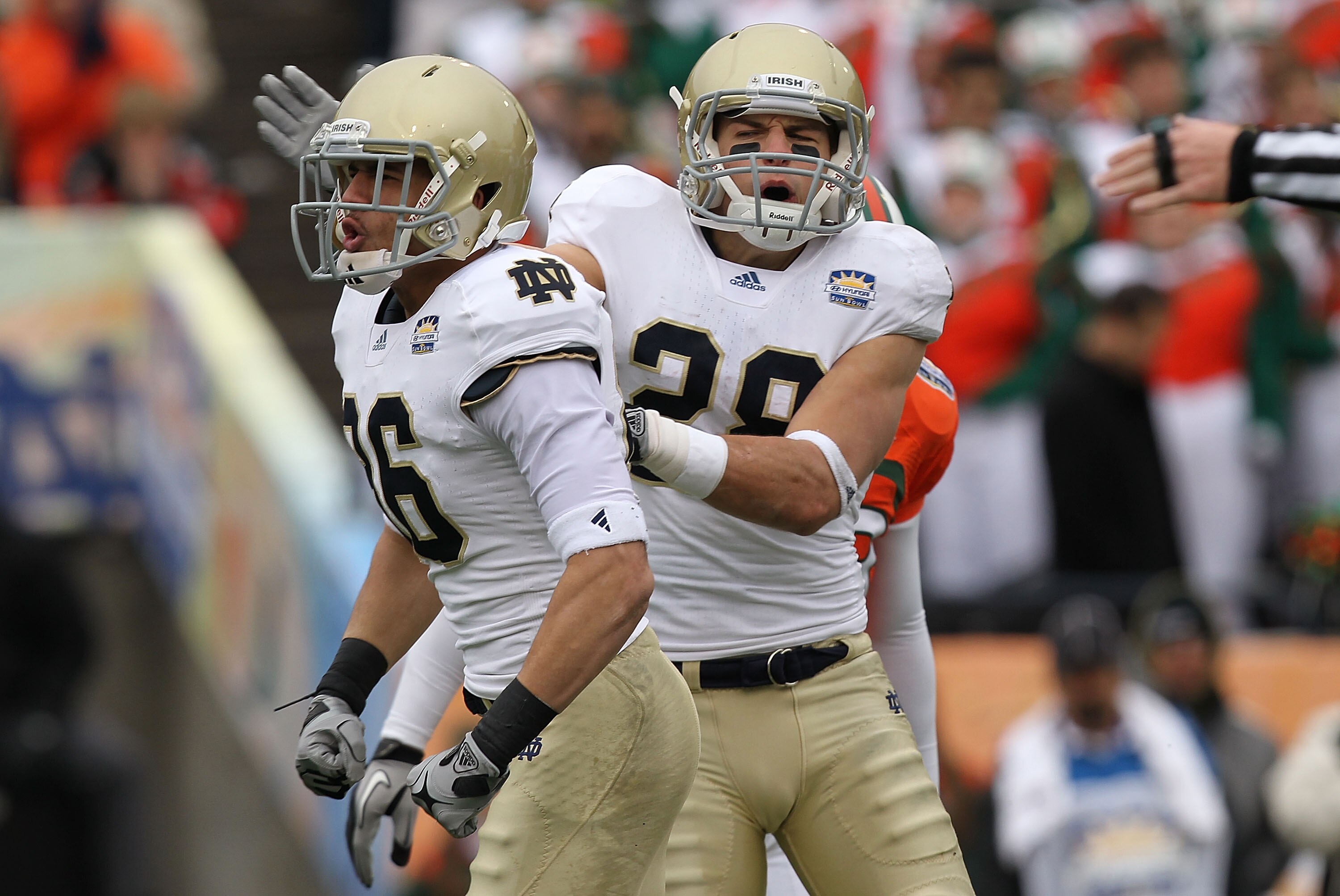 EL PASO, TX - DECEMBER 30:  (L-R) Bennett Jackson #86 and Austin Collinsworth #28 of the Notre Dame Fighting Irish celebrate a tackle against the Miami Hurricanes at Sun Bowl on December 30, 2010 in El Paso, Texas.  (Photo by Ronald Martinez/Getty Images)
