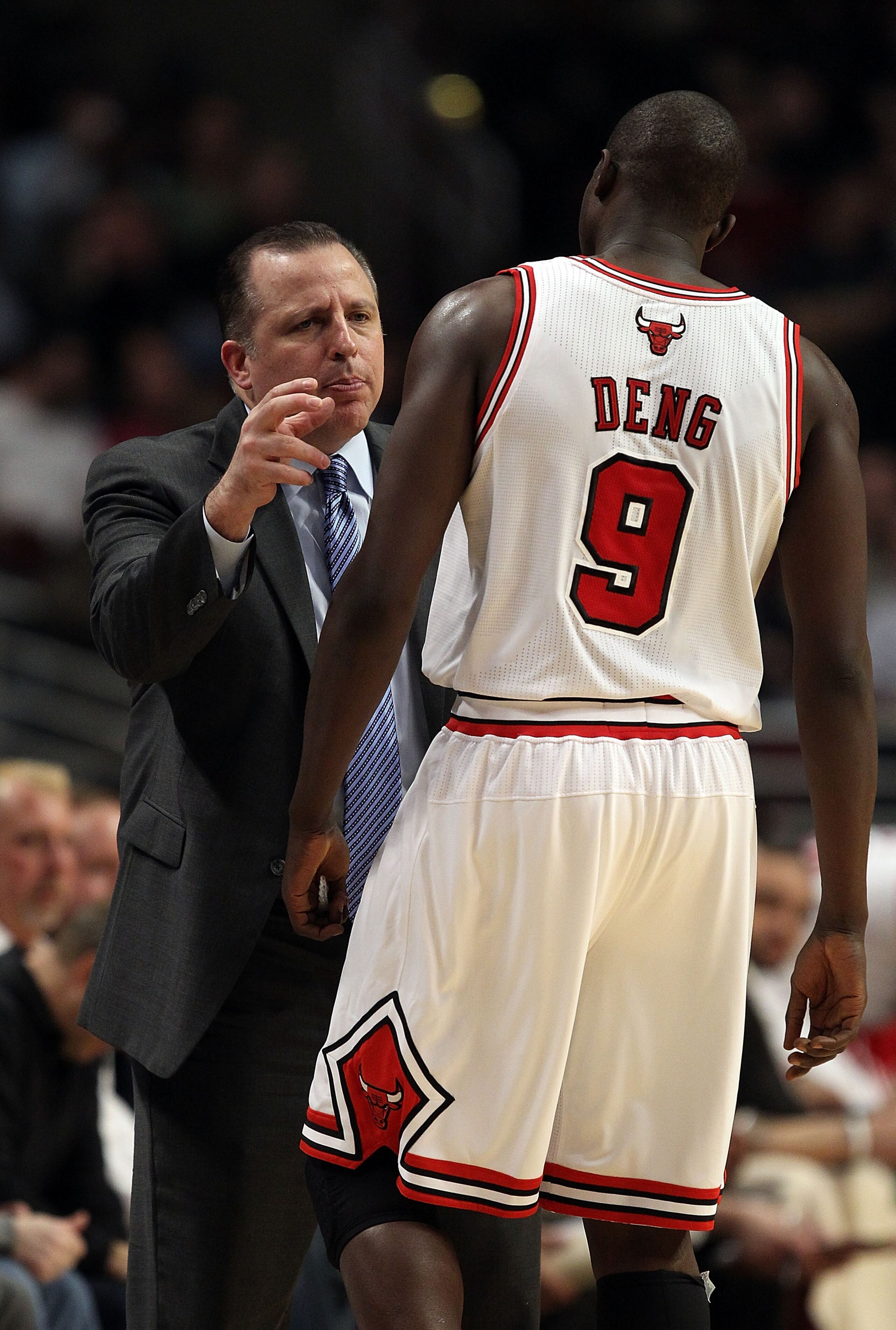 CHICAGO, IL - FEBRUARY 17: Head coach Tom Thibodeau of the Chicago Bulls gives instructions to Loul Deng #9 during a game against the San Antonio Spurs at the United Center on February 17, 2011 in Chicago, Illinois. NOTE TO USER: User expressly acknowledg
