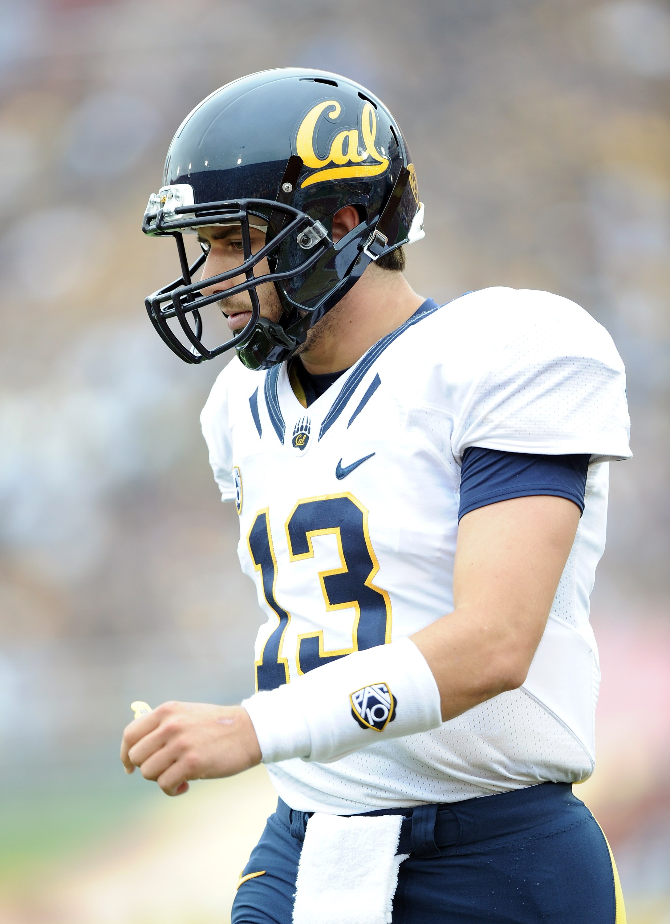 LOS ANGELES, CA - OCTOBER 16:  Kevin Riley #13 of the California Golden Bears returns to the field  against the USC Trojans at Los Angeles Memorial Coliseum on October 16, 2010 in Los Angeles, California.  (Photo by Harry How/Getty Images)