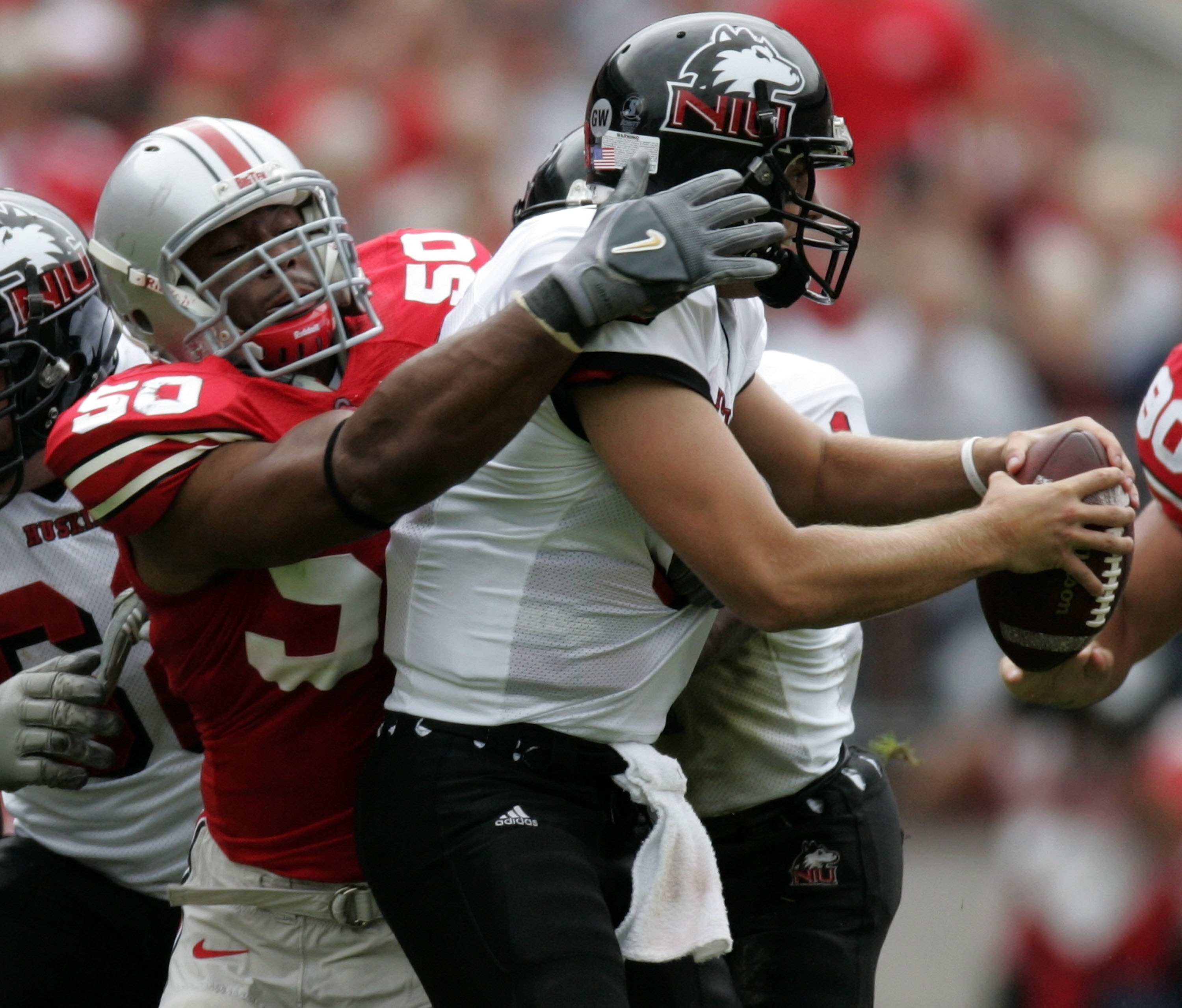 COLUMBUS, OH - SEPTEMBER 02:  Vernon Gholston #50 of the Ohio State Buckeyes sacks Phil Horvath #3 of the Northern Illinois Huskies on September 2, 2006 at Ohio Stadium in Columbus, Ohio. Ohio State won the game 35-12.  (Photo by Gregory Shamus/Getty Imag