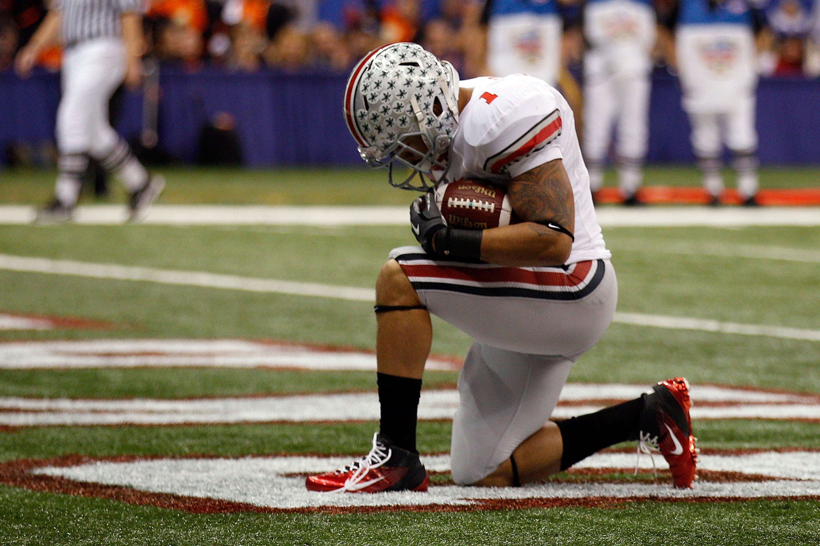 NEW ORLEANS, LA - JANUARY 04:  Dan Herron #1 of the Ohio State Buckeyes reacts after he scores on a nine-yard touchdown run in the first half against the Arkansas Razorbacks during the Allstate Sugar Bowl at the Louisiana Superdome on January 4, 2011 in N