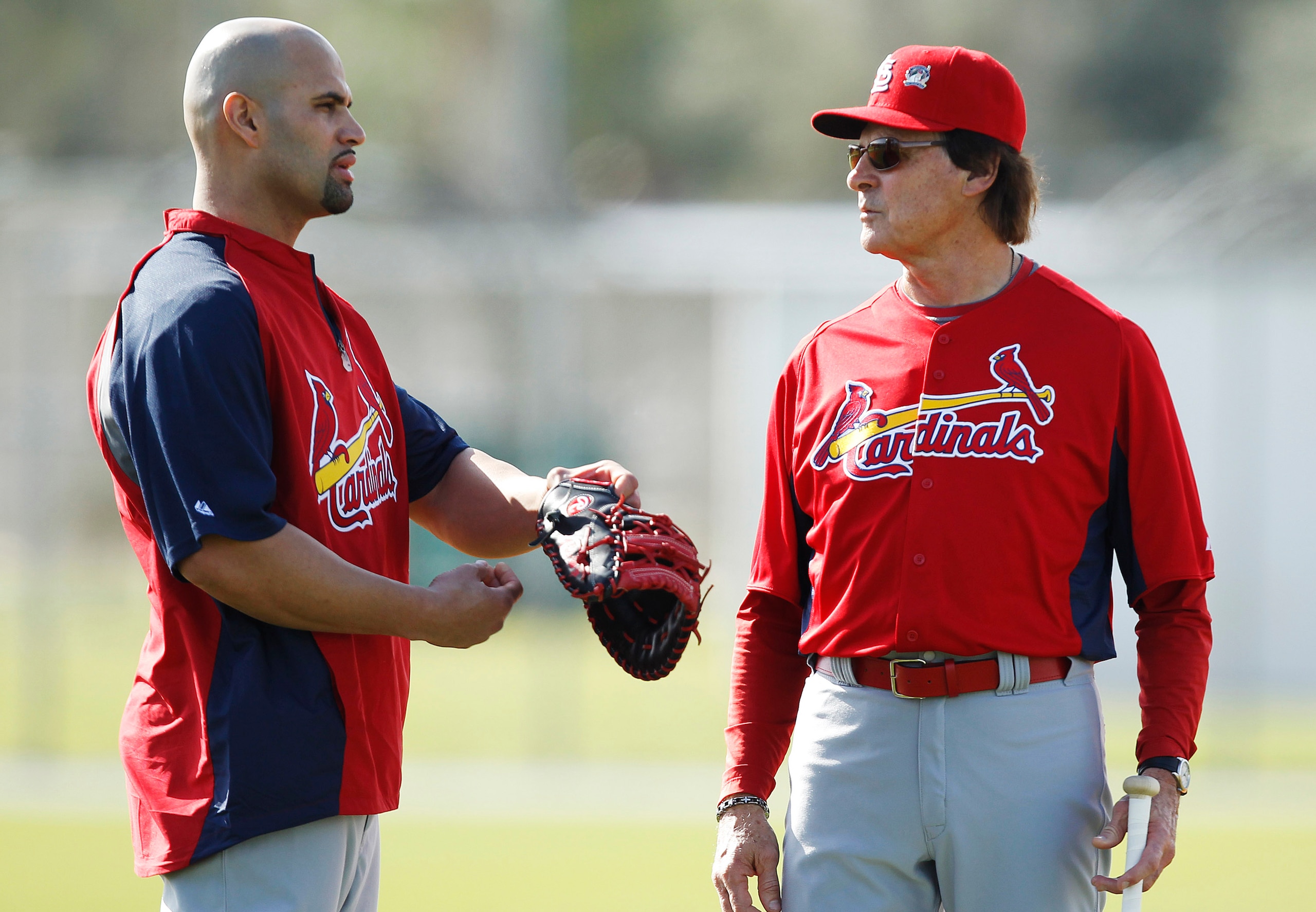 JUPITER, FL - FEBRUARY 17: Albert Pujols #5 #5 of the St. Louis Cardinals talks to Manager Tony La Russa #10 at Roger Dean Stadium on February 17, 2011 in Jupiter, Florida. (Photo by Joel Auerbach/Getty Images)