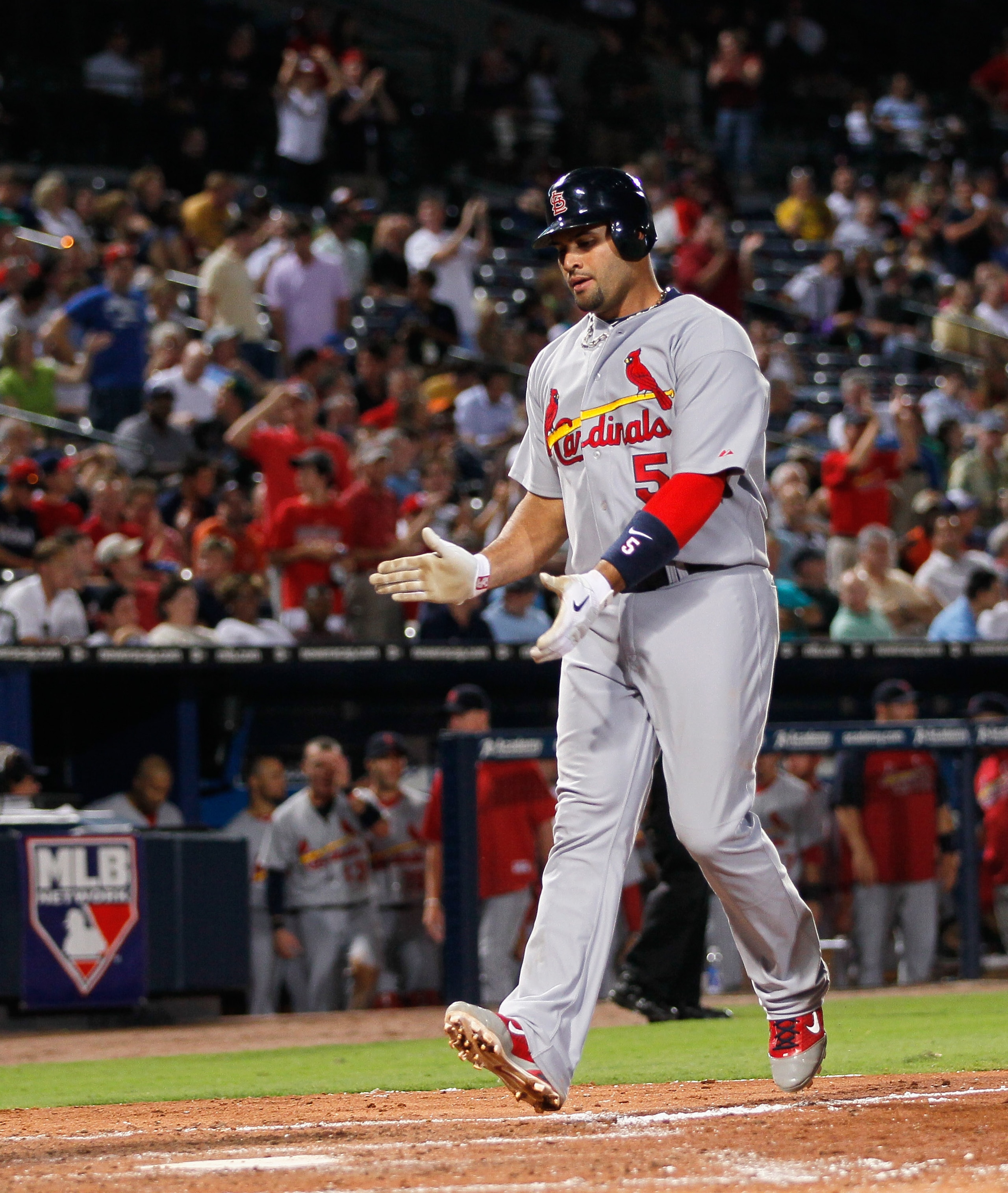 ATLANTA - SEPTEMBER 09:  Albert Pujols #5 of the St. Louis Cardinals crosses homeplate after hitting a solo homer in the fourth inning against the Atlanta Braves at Turner Field on September 9, 2010 in Atlanta, Georgia.  (Photo by Kevin C. Cox/Getty Image