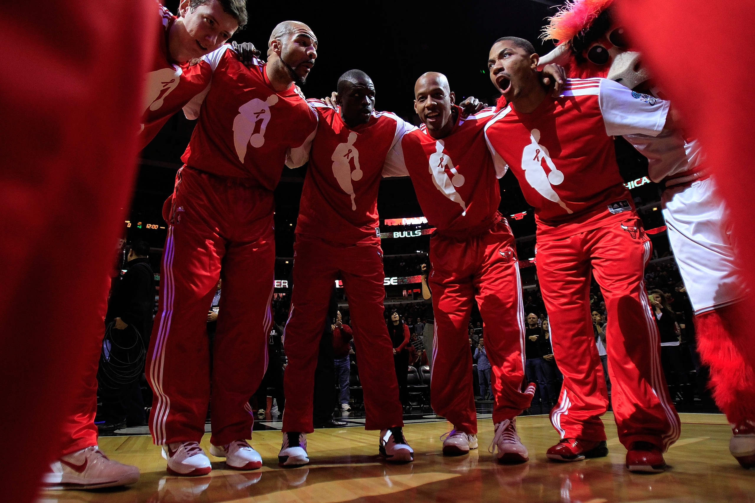 CHICAGO, IL - DECEMBER 01: (L-R) Omer Asik #3, Carlos Boozer #5, Loul Deng #9, Keith Bogans #6 and Derrick Rose #1 of the Chicago Bulls gather in a huddle after player introductions before a game against the Orlando Magic at the United Center on December