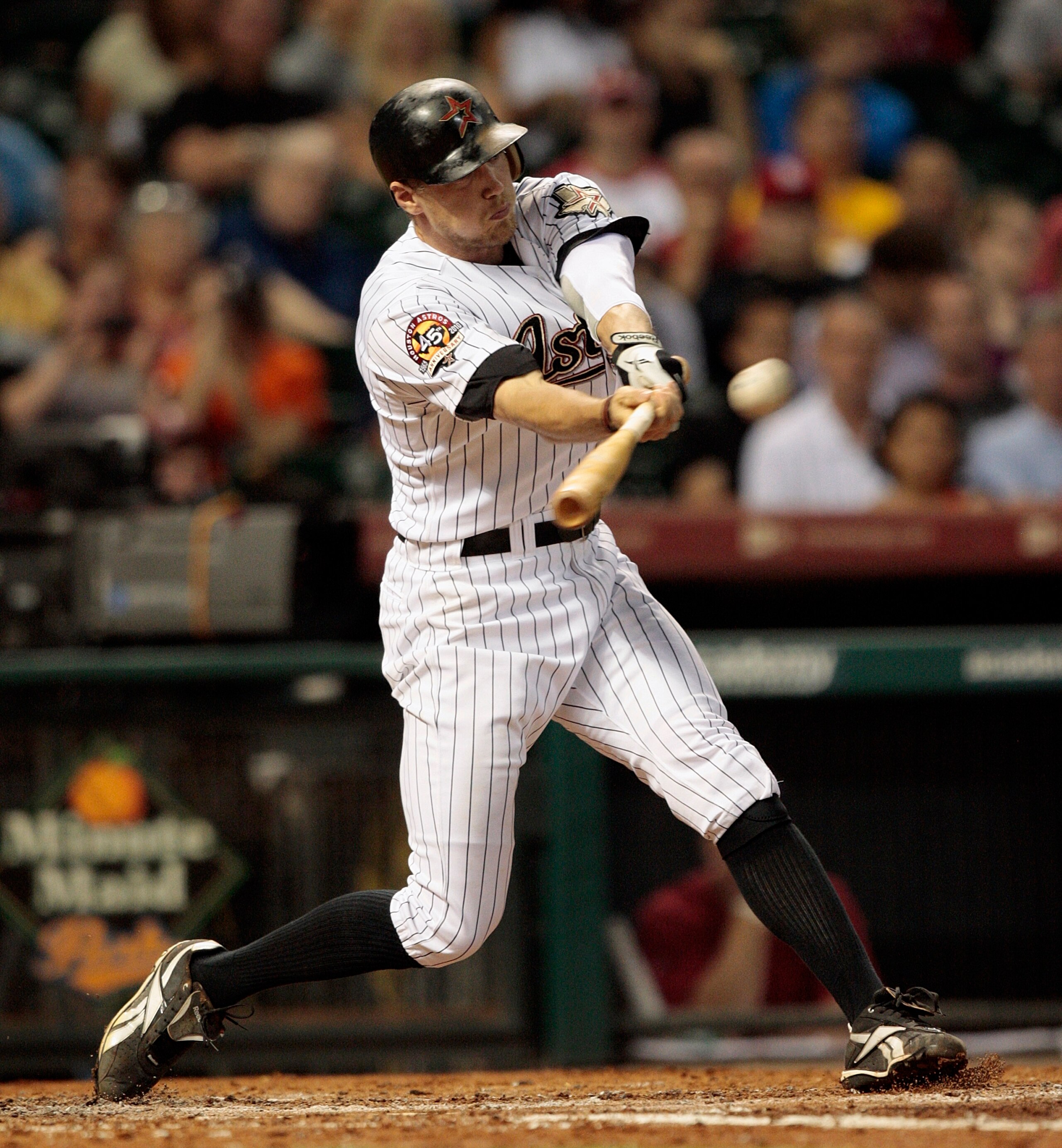 HOUSTON - AUGUST 31:  Hunter Pence #9 of the Houston Astros triples to center field in the fourth inning scoring two runs against the St. Louis Cardinals at Minute Maid Park on August 31, 2010 in Houston, Texas.  (Photo by Bob Levey/Getty Images)