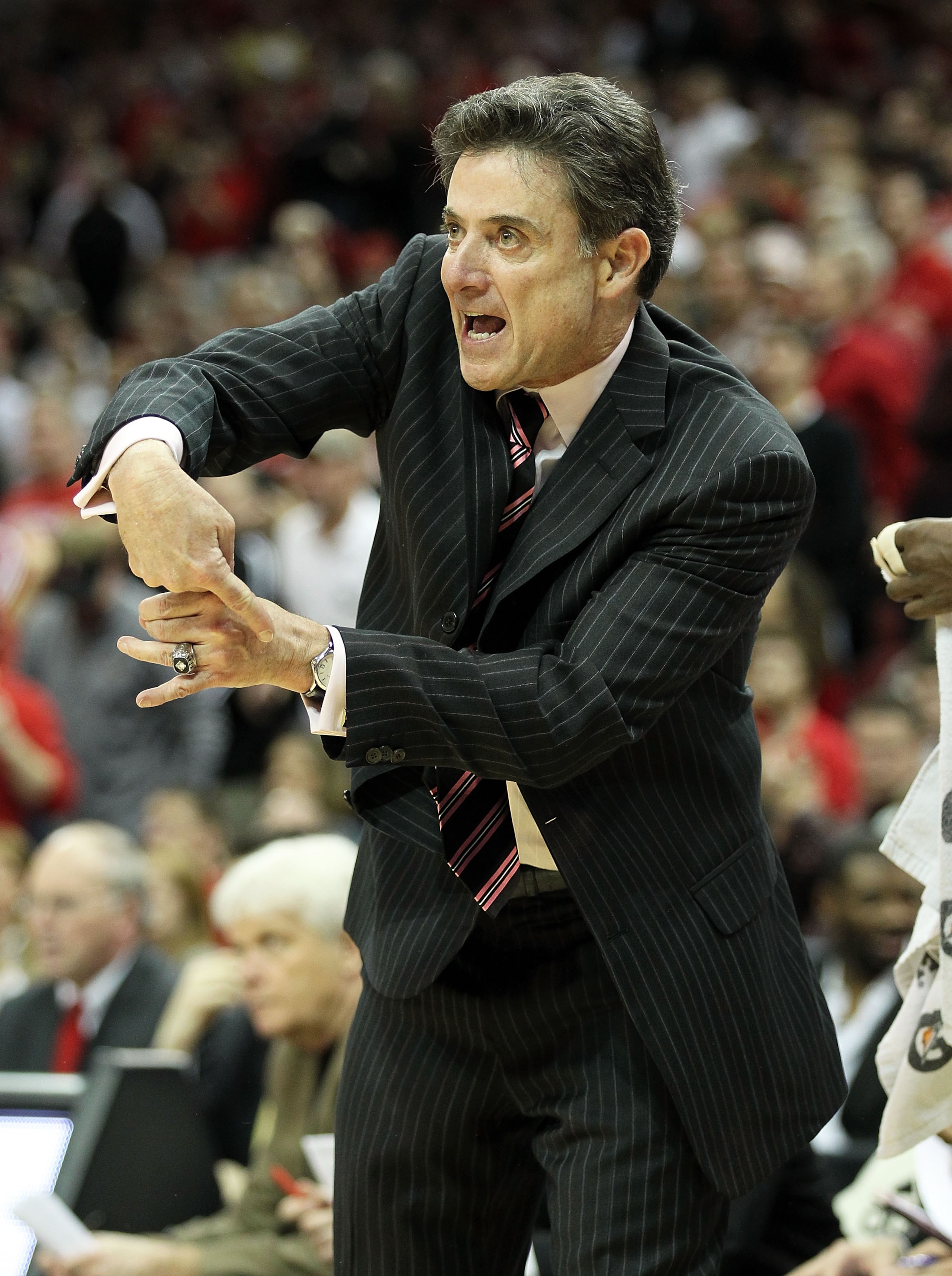 LOUISVILLE, KY - FEBRUARY 18:  Head coach Rick Pitino of the Louisville Cardinals gives instructions to his team during the Big East Conference game against the Connecticut Huskies at the KFC Yum! Center on February 18, 2011 in Louisville, Kentucky.  (Pho