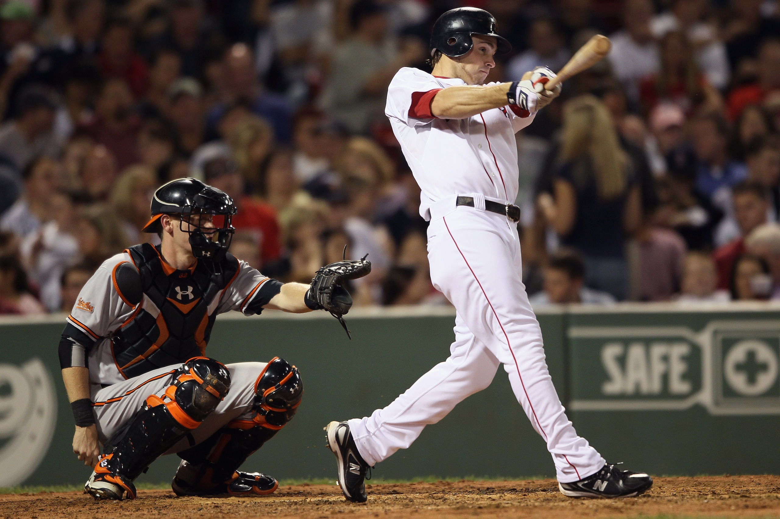 BOSTON - SEPTEMBER 22:  Josh Reddick #46 of the Boston Red Sox hits a solo home run in the fifth inning as Matt Wieters #32 of the Baltimore Orioles defends on September 22, 2010 at Fenway Park in Boston, Massachusetts.  (Photo by Elsa/Getty Images)