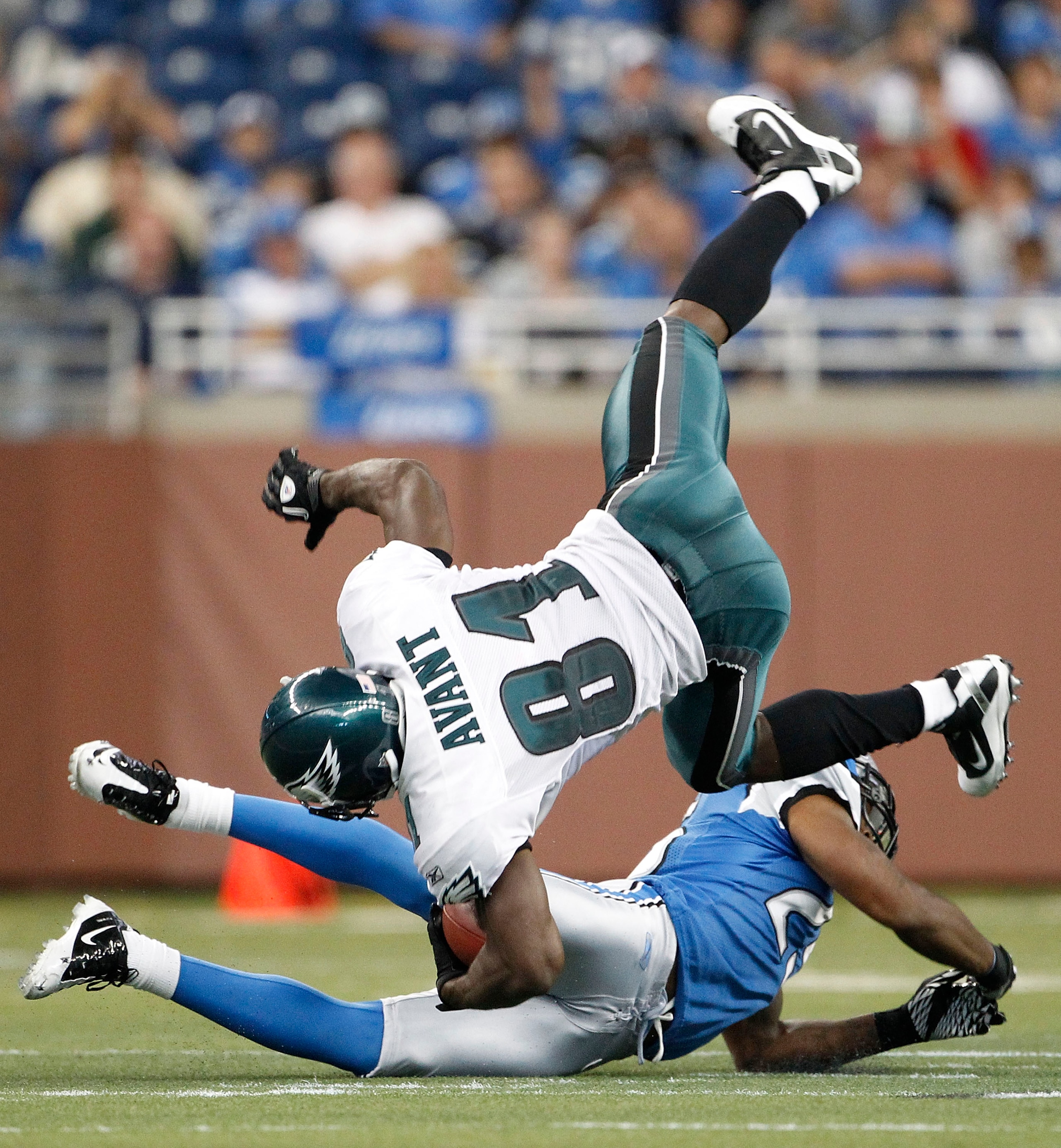 DETROIT - SEPTEMBER 19:  Jason Avant #81 of the Philadelphia Eagles is tackled after an 18 yard reception by Randy Phillips #25 of the Detroit Lions during the fourth quarter of the game at Ford Field on September 19, 2010 in Detroit, Michigan. The Eagles