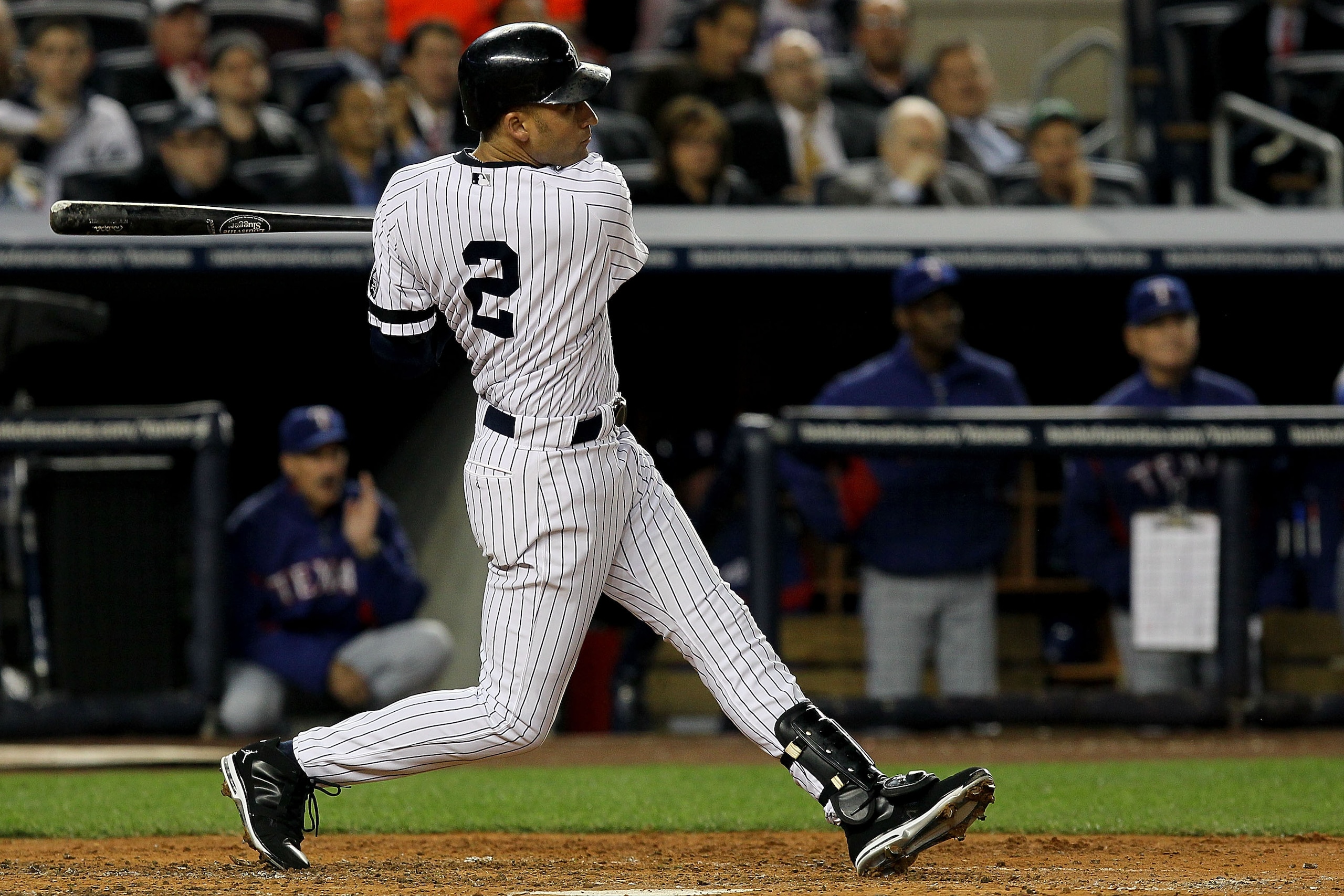 NEW YORK - OCTOBER 19:  Derek Jeter #2 of the New York Yankees hits a triple in the third inning against the Texas Rangers in Game Four of the ALCS during the 2010 MLB Playoffs at Yankee Stadium on October 19, 2010 in the Bronx borough of New York City.