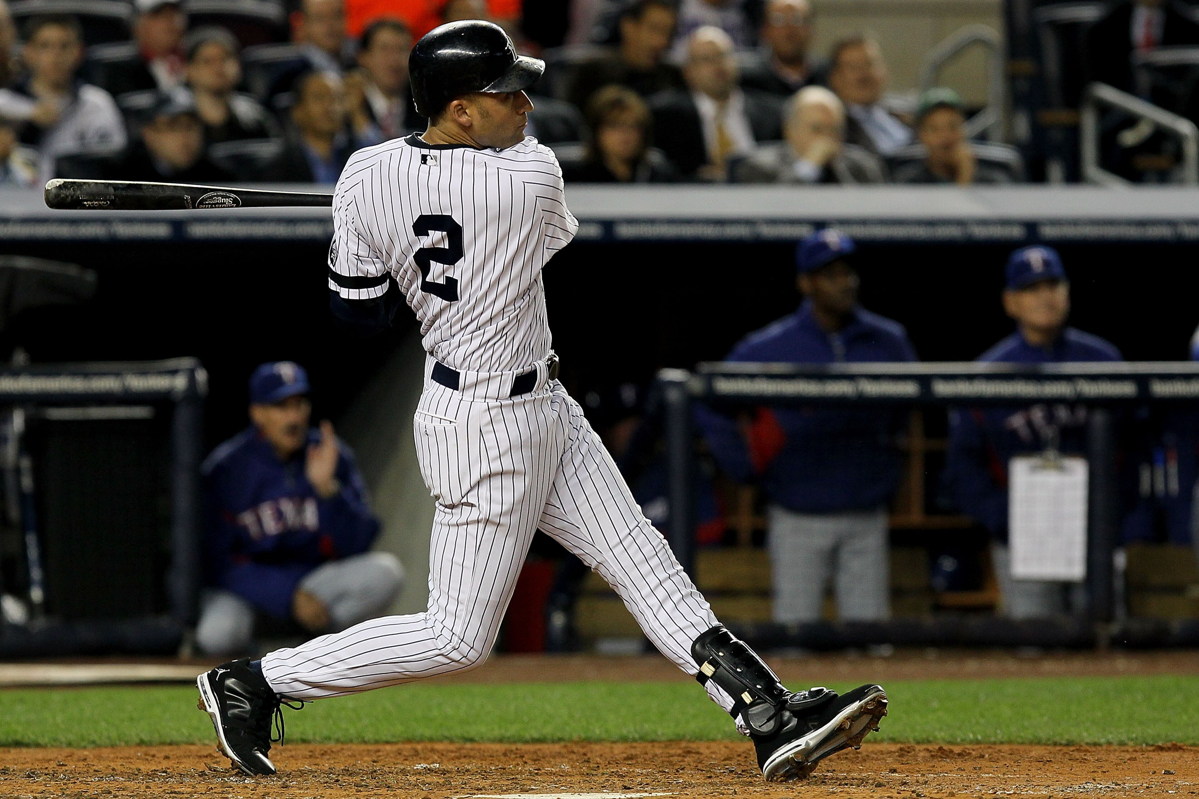 NEW YORK - OCTOBER 19:  Derek Jeter #2 of the New York Yankees hits a triple in the third inning against the Texas Rangers in Game Four of the ALCS during the 2010 MLB Playoffs at Yankee Stadium on October 19, 2010 in the Bronx borough of New York City.