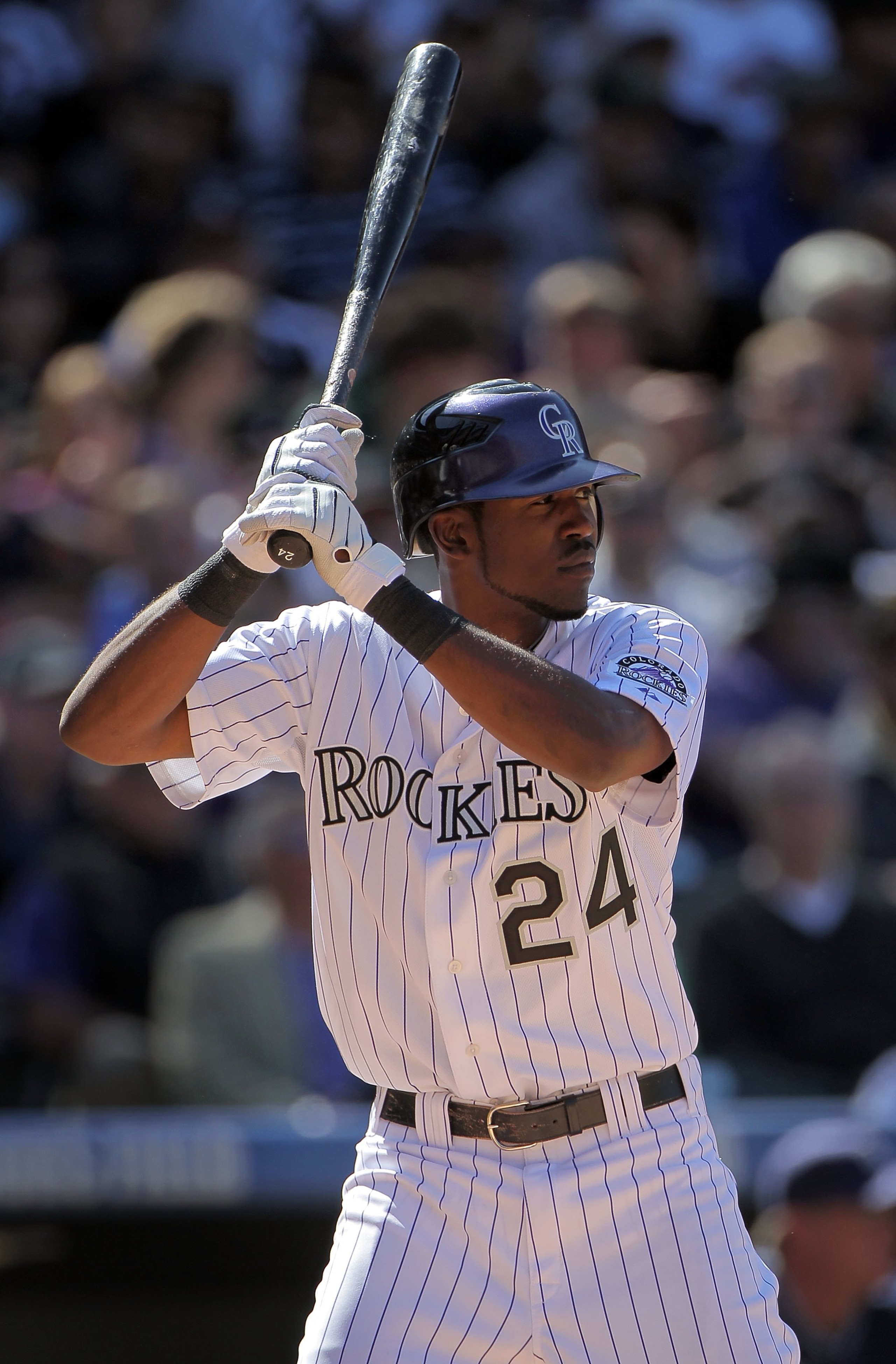 DENVER - APRIL 09:  Dexter Fowler #24 of the Colorado Rockies takes an at bat against the San Diego Padres during MLB action on Opening Day at Coors Field on April 9, 2010 in Denver, Colorado. The Rockies defeated the Padres 7-0.  (Photo by Doug Pensinger