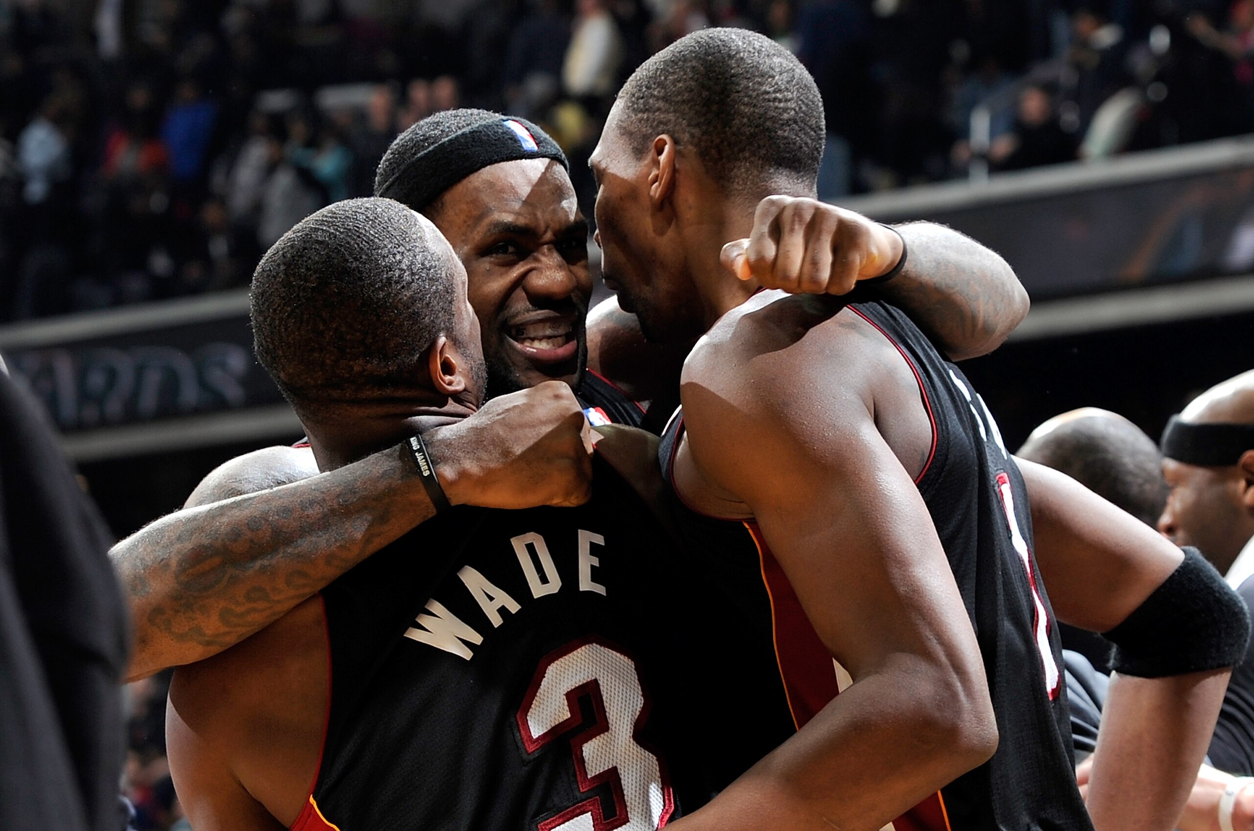 WASHINGTON - DECEMBER 18:  LeBron James #6 of the Miami Heat celebrates with Dwyane Wade #3 and Chris Bosh #1 after a 95-94 victory over the Washington Wizards at the Verizon Center on December 18, 2010 in Washington, DC. NOTE TO USER: User expressly ackn