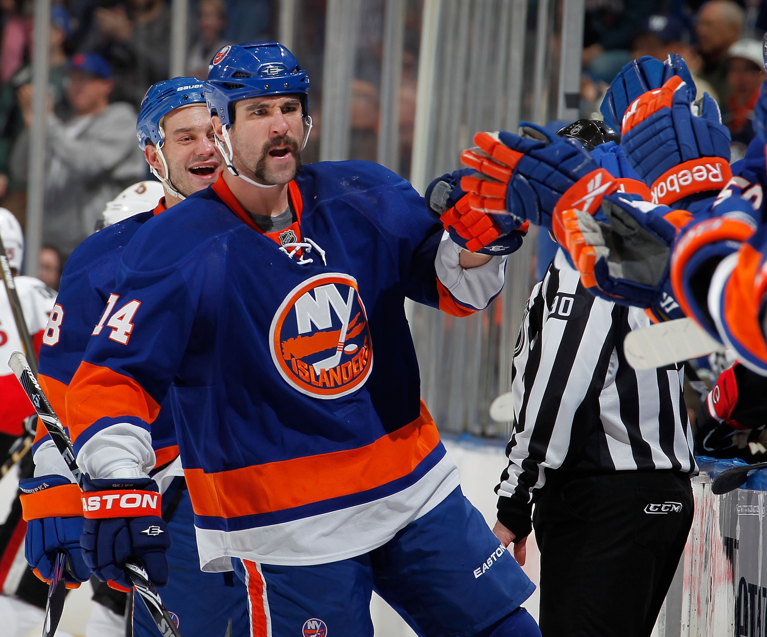 UNIONDALE, NY - JANUARY 13:  Trevor Gillies #14 of the New York Islanders celebrates scoring a goal in the first period of an NHL hockey game against the Ottawa Senators at the Nassau Coliseum on January 13, 2011 in Uniondale, New York.  (Photo by Paul Be