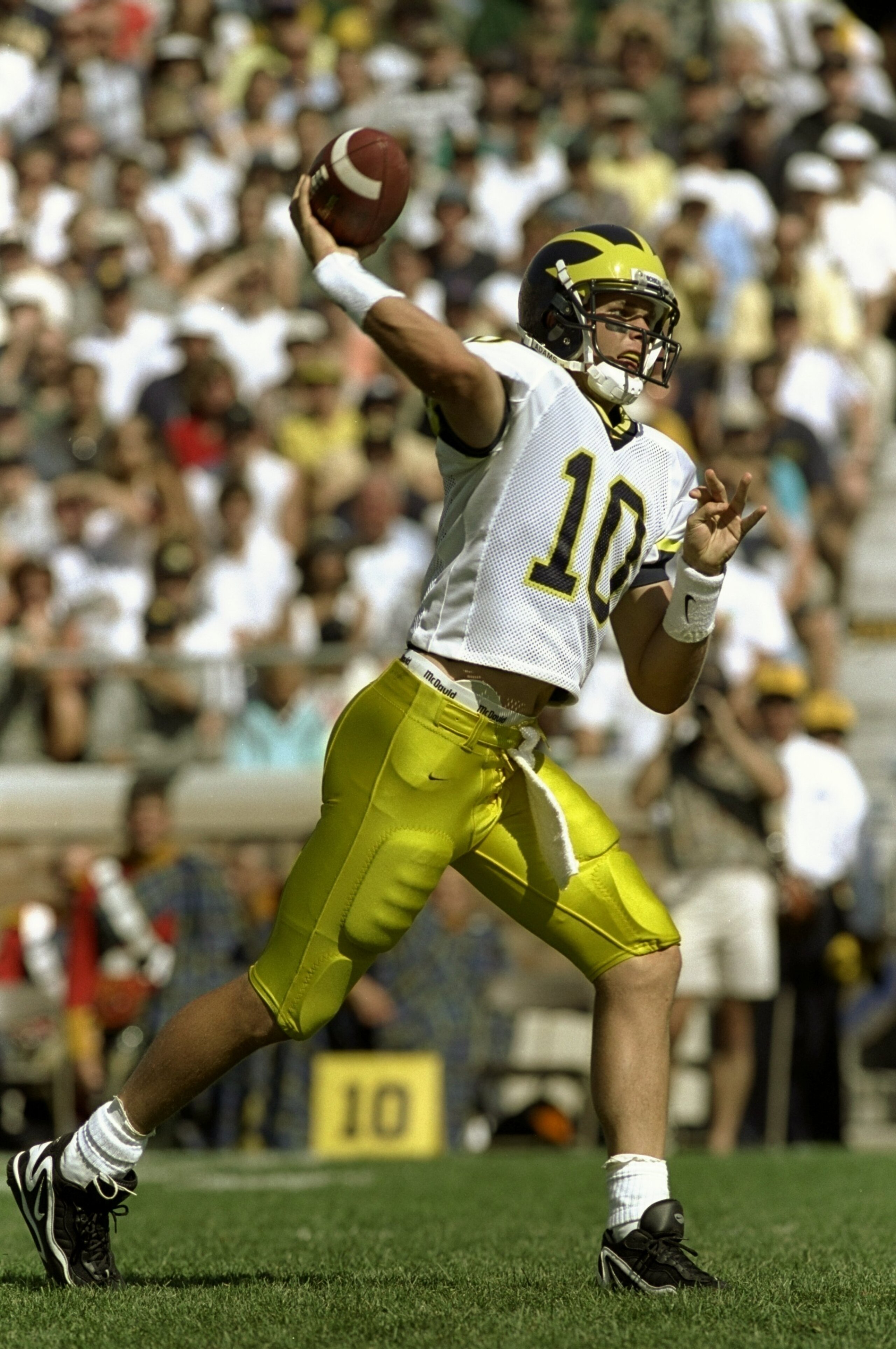 5 Sep 1998:  Quarterback Tom Brady #10 of the Michigan Wolverines throws a pass during a game against the Notre Dame Fighting Irish at the Notre Dame Stadium in South Bend, Indiana. The Fighting Irish defeated the Wolverines 36-20.