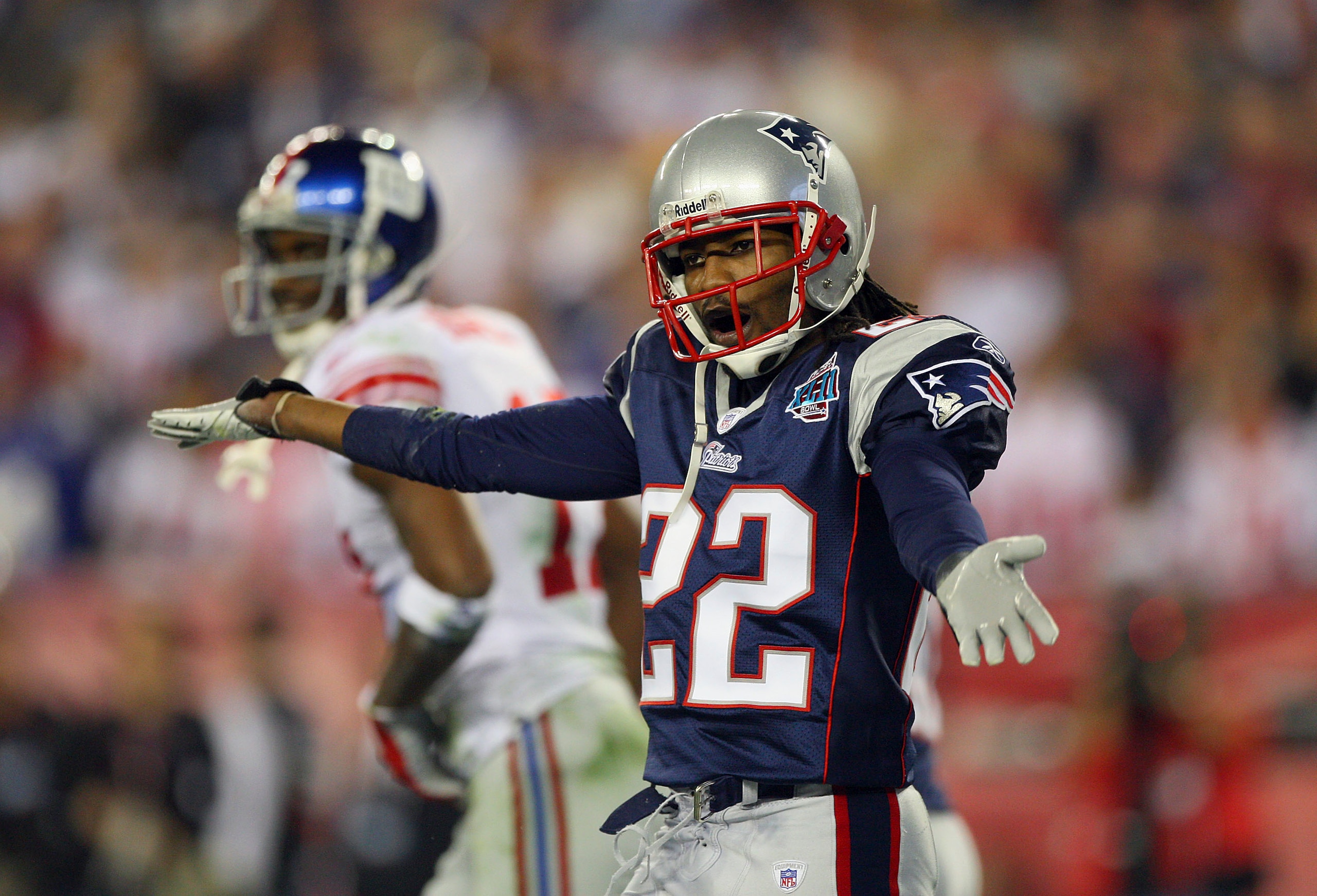 GLENDALE, AZ - FEBRUARY 03:  Cornerback Asante Samuel #22 of the New England Patriots celebrates after breaking-up a pass thrown to wide receiver Plaxico Burress #17 of the New York Giants (not pictured) in the third quarter during Super Bowl XLII on Febr