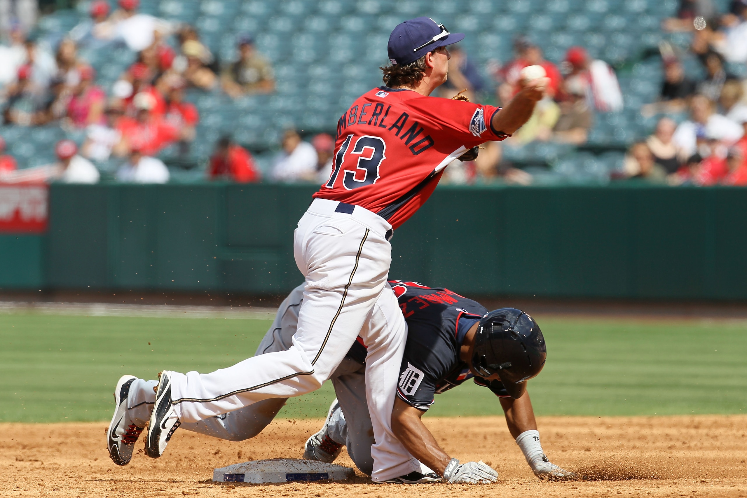 ANAHEIM, CA - JULY 11:  U.S. Futures All-Star Drew Cumberland #13 of the San Diego Padres looks to turn a double play as World Futures All-Star Wilkin Ramirez #33 of the Detroit Tigers is out at second base during the 2010 XM All-Star Futures Game at Ange