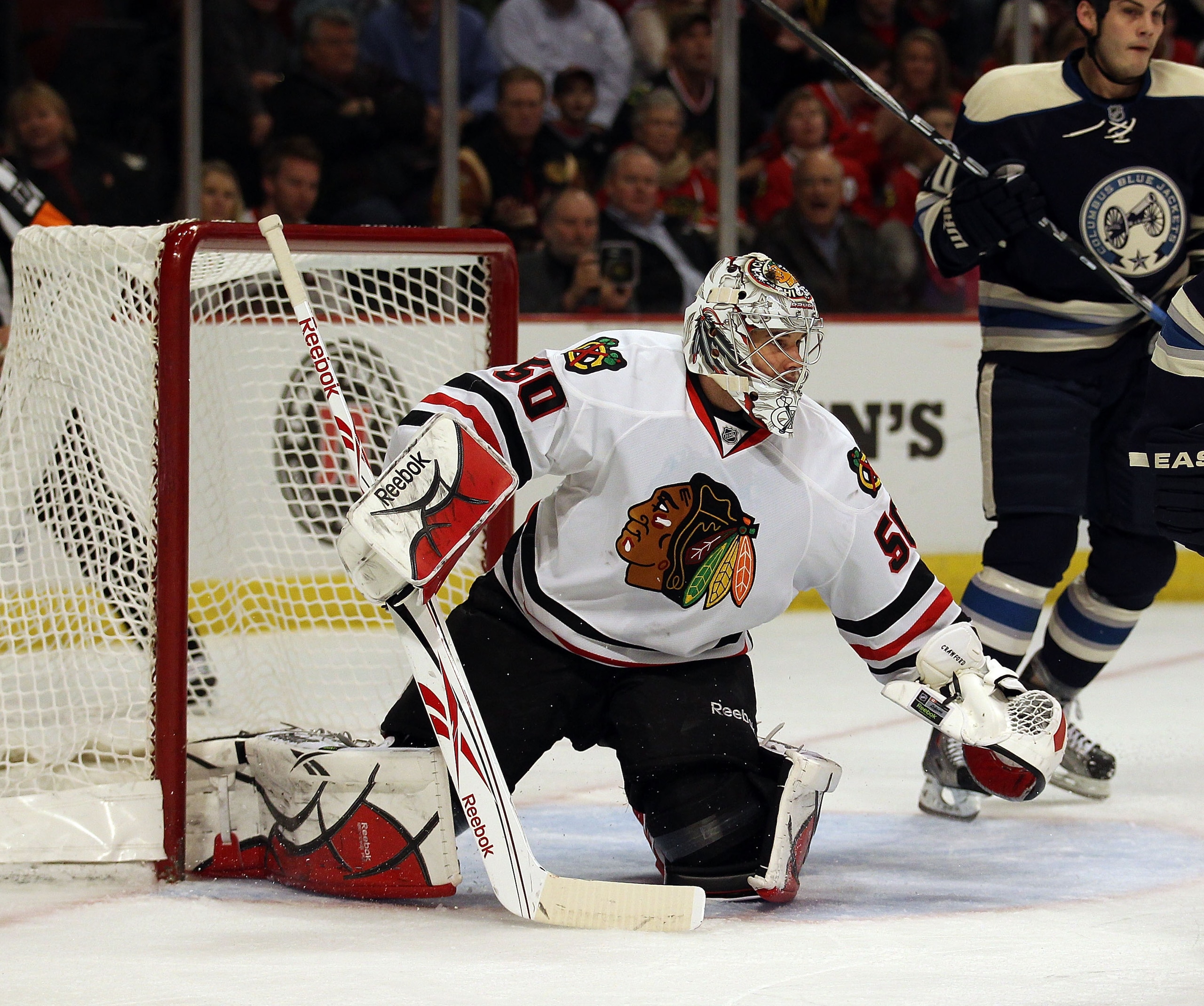 CHICAGO, IL - FEBRUARY 18: Corey Crawford #50 of the Chicago Blackhawks follows the action in front of him during a game against the Columbus Blue Jackets at the United Center on February 18, 2011 in Chicago, Illinois. The Blue Jackets defeated the Blackh