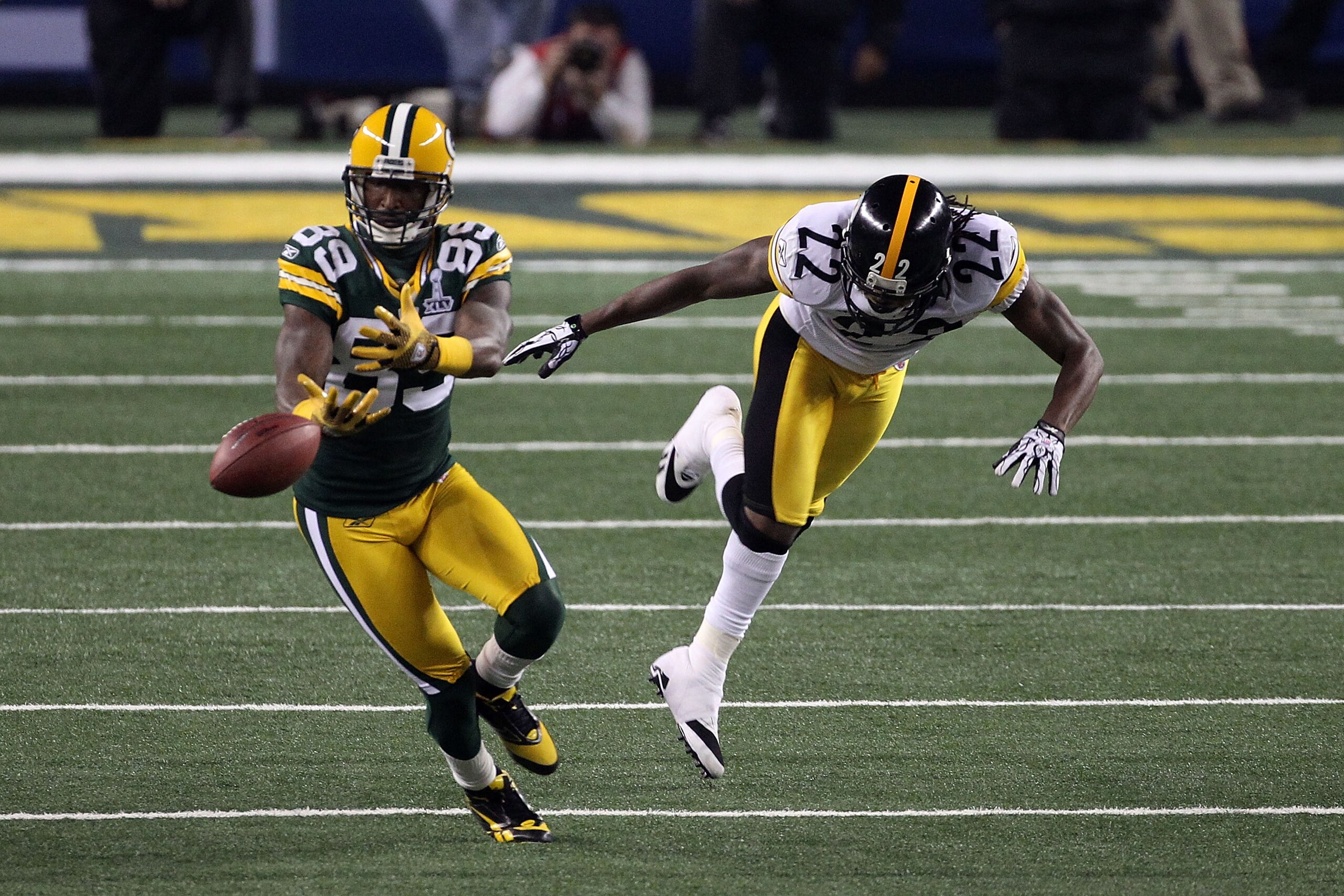 ARLINGTON, TX - FEBRUARY 06:  James Jones #89 of the Green Bay Packers drops a pass in the third quarter against William Gay #22 of the Pittsburgh Steelers during Super Bowl XLV at Cowboys Stadium on February 6, 2011 in Arlington, Texas.  (Photo by Street