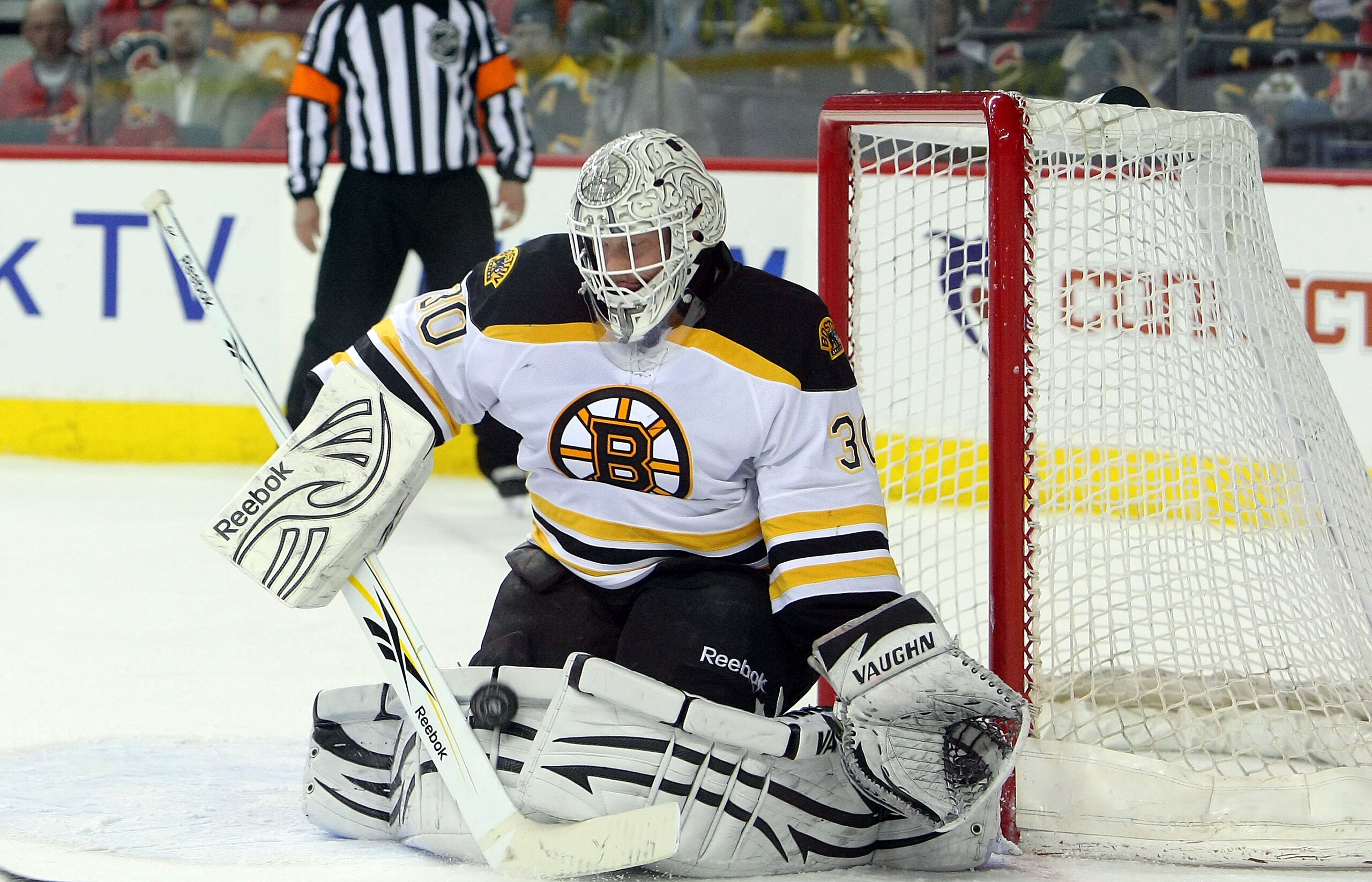 CALGARY,CANADA - FEBRUARY 22:  Tim Thomas #30 of the Boston Bruins makes a save against the Calgary Flames their NHL game at Scotiabank Saddledome, February 22,2011 in Calgary, Alberta, Canada.(Photo By Dave Sandford/Getty Images)