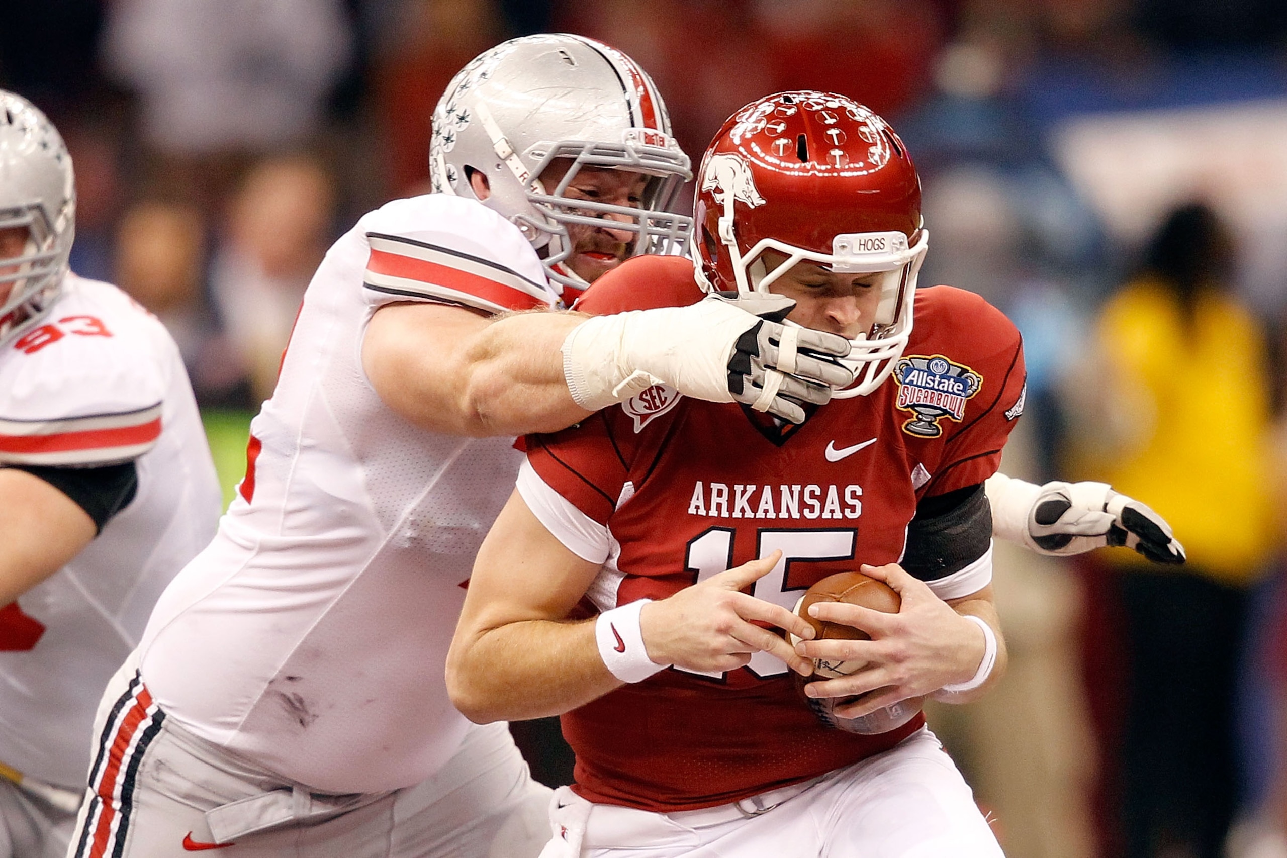 NEW ORLEANS, LA - JANUARY 04:  Dexter Larimore #72 of the Ohio State Buckeyes sacks Ryan Mallett #15 of the Arkansas Razorbacks in the second quarter during the Allstate Sugar Bowl at the Louisiana Superdome on January 4, 2011 in New Orleans, Louisiana.