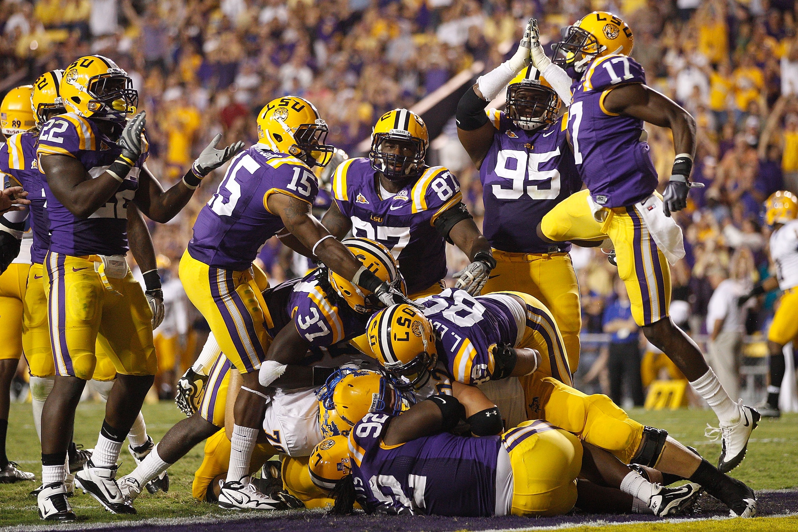 BATON ROUGE, LA - OCTOBER 16:  Drake Nevis #92  of the Louisiana State University Tigers tackles for a safety in the endzone Andre Anderson #22 of the McNeese State Cowboys at Tiger Stadium on October 16, 2010 in Baton Rouge, Louisiana.  (Photo by Chris G