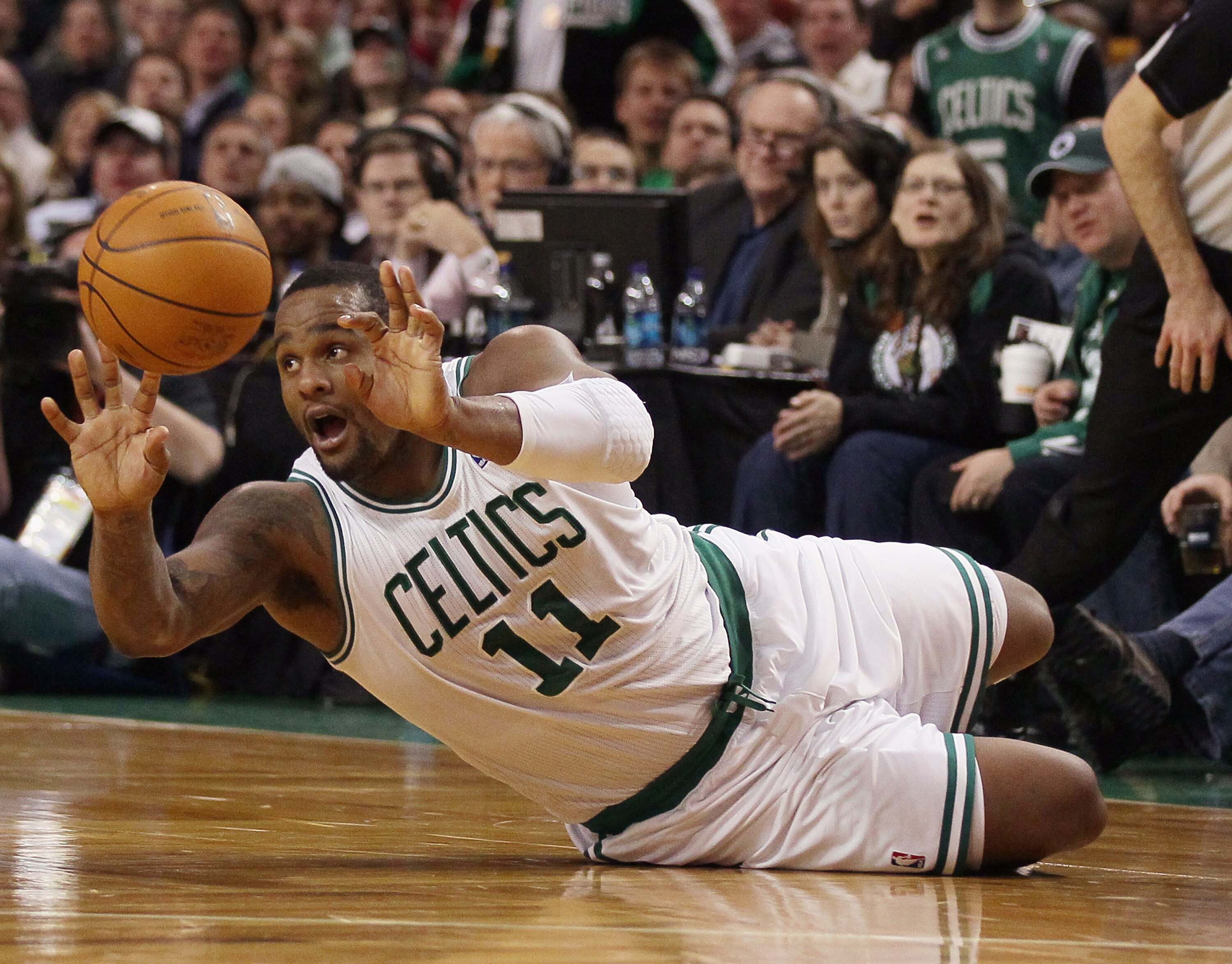 BOSTON, MA - JANUARY 10:  Glen Davis #11 of the Boston Celtics passes the ball after he knocked it away from Patrick Patterson of he Houston Rockets on January 10, 2011 at the TD Garden in Boston, Massachusetts.  NOTE TO USER: User expressly acknowledges