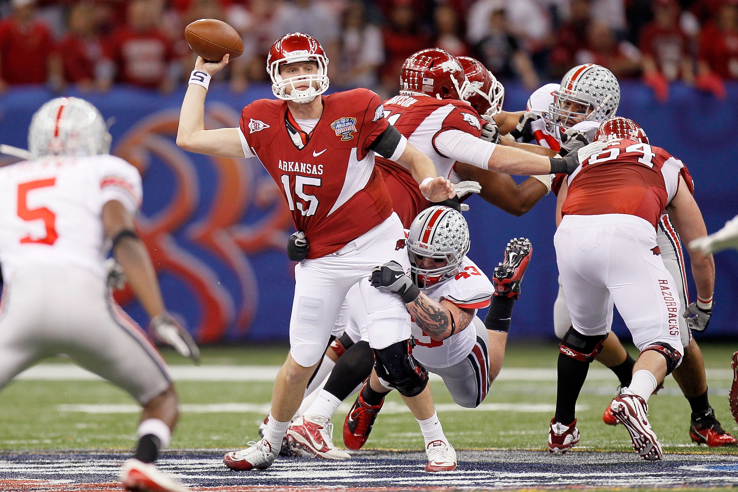 NEW ORLEANS, LA - JANUARY 04:  Quarterback Ryan Mallett #15 of the Arkansas Razorbacks attempts to throw as Nathan Williams #43 of the Ohio State Buckeyes attempts to sack Mallett in the first half during the Allstate Sugar Bowl at the Louisiana Superdome