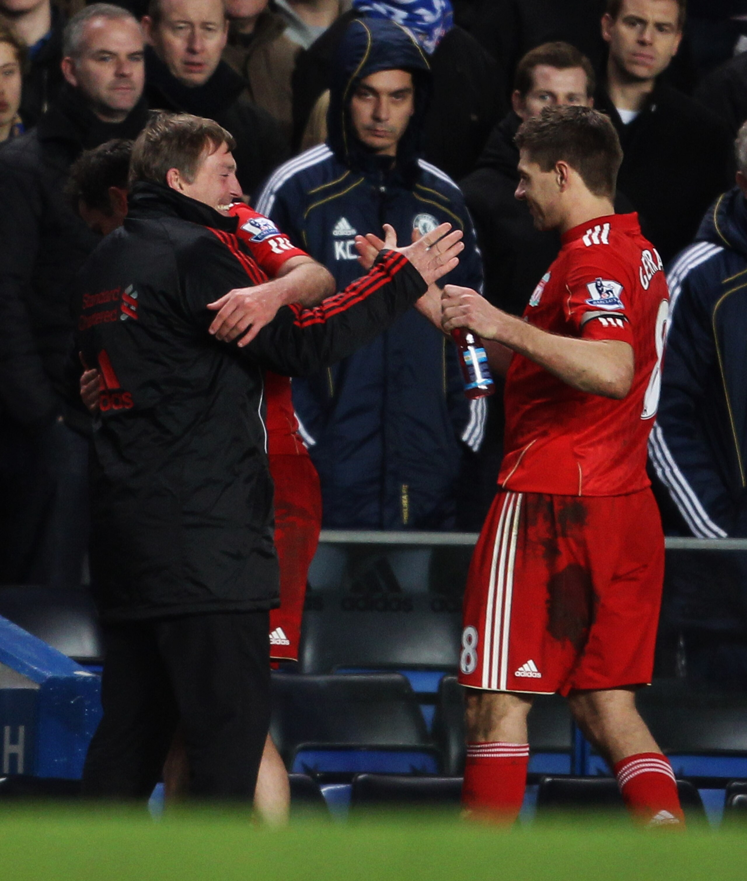 LONDON, ENGLAND - FEBRUARY 06:  Kenny Dalglish manager of Liverpool celebrates with Jamie Carragher and Steven Gerrard after the Barclays Premier League match between Chelsea and Liverpool at Stamford Bridge on February 6, 2011 in London, England.  (Photo