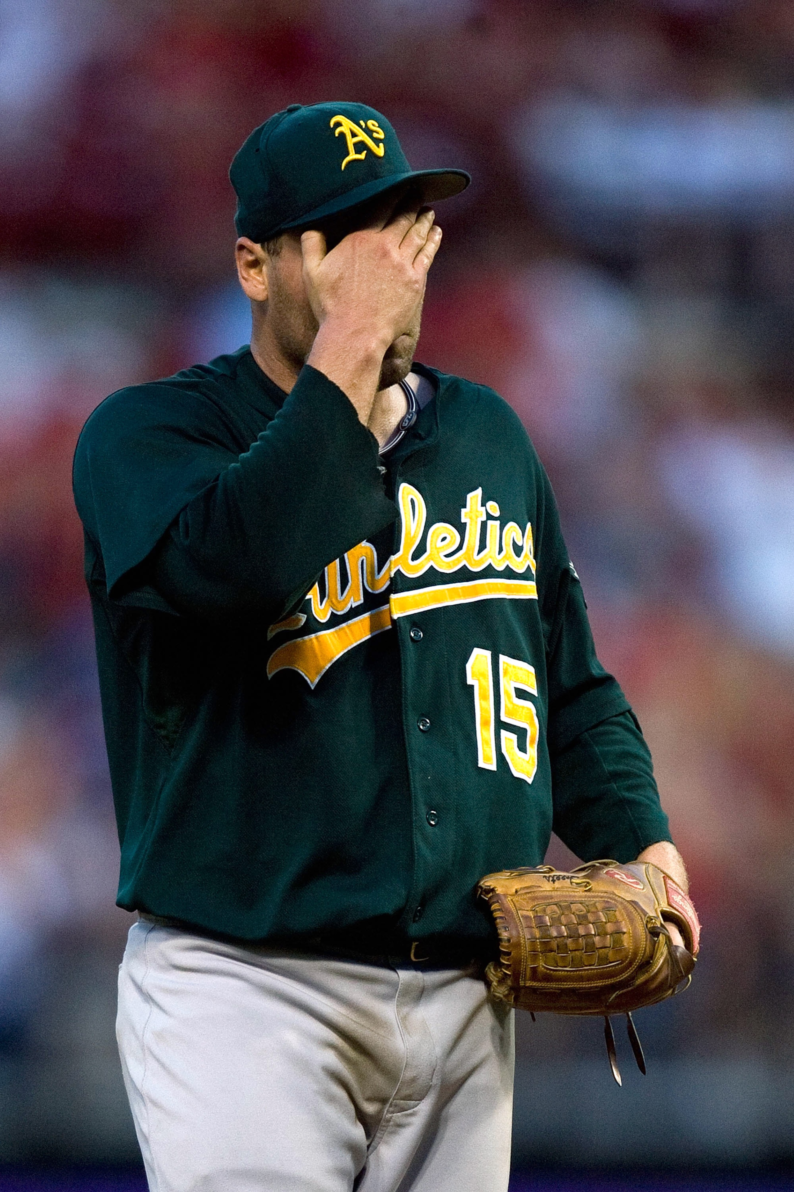 ST. LOUIS - JUNE 19: Starting pitcher Ben Sheets #15 of the Oakland Athletics reacts after giving up a two-run home run against the St. Louis Cardinals at Busch Stadium on June 19, 2010 in St. Louis, Missouri.  The Cardinals beat the Athletics 4-3.  (Phot