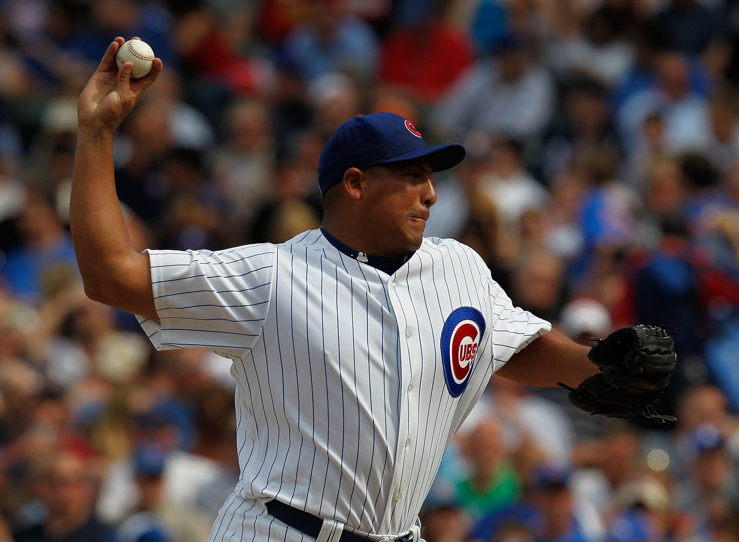 CHICAGO - APRIL 15: Starting pitcher Carlos Zambrano of the Chicago Cubs, wearing a number 42 jersey in honor of Jackie Robinson, delivers the ball against the Milwaukee Brewers at Wrigley Field on April 15, 2010 in Chicago, Illinois. The Brewers defeated