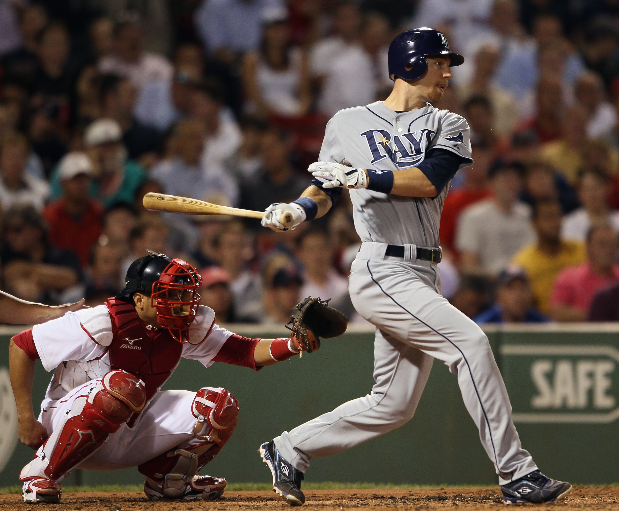BOSTON - SEPTEMBER 07:  Ben Zobrist #18 of the Tampa Bay Rays hits a two run homer in the third inning as Victor Martinez #41 of the Boston Red Sox  defends on September 7, 2010 at Fenway Park in Boston, Massachusetts.  (Photo by Elsa/Getty Images)