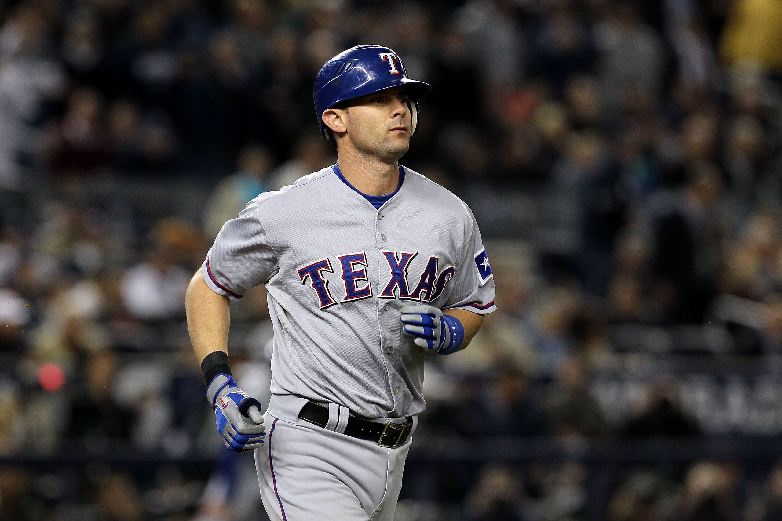 NEW YORK - OCTOBER 19:  Michael Young #10 of the Texas Rangers runs towards first base against the New York Yankees in Game Four of the ALCS during the 2010 MLB Playoffs at Yankee Stadium on October 19, 2010 in the Bronx borough of New York City.  (Photo