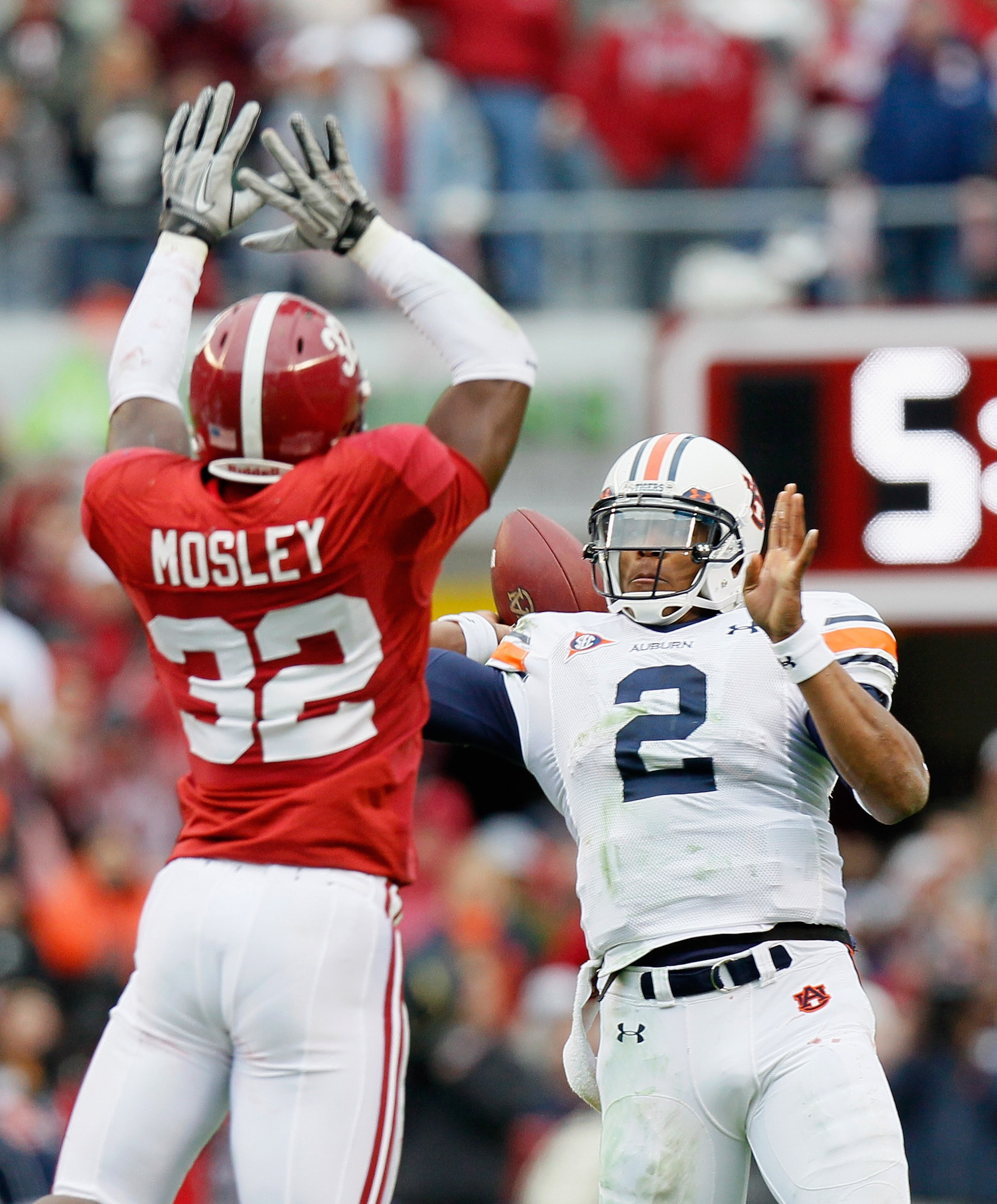 TUSCALOOSA, AL - NOVEMBER 26: Quarterback Cam Newton #2 of the Auburn Tigers is pressured on the touchdown pass by C.J. Mosley #32 of the Alabama Crimson Tide at Bryant-Denny Stadium on November 26, 2010 in Tuscaloosa, Alabama. (Photo by Kevin C. Cox/Ge TUSCALOOSA, AL - NOVEMBER 26: Quarterback Cam Newton #2 of the Auburn Tigers is pressured on the touchdown pass by C.J. Mosley #32 of the Alabama Crimson Tide at Bryant-Denny Stadium on November 26, 2010 in Tuscaloosa, Alabama. (Photo by Kevin C. Cox/Ge