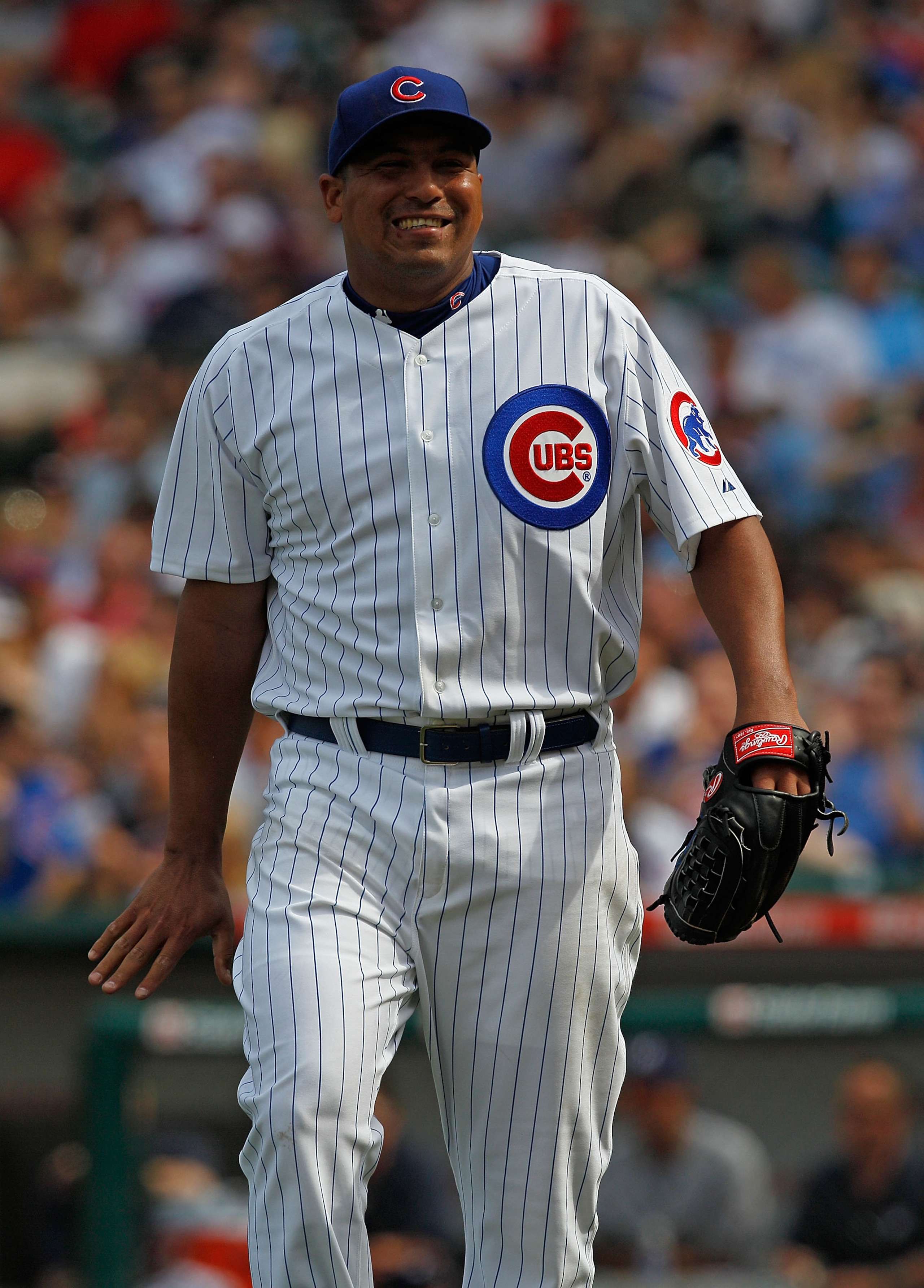 CHICAGO - APRIL 15: Starting pitcher Carlos Zambrano of the Chicago Cubs, wearing a number 42 jersey in honor of Jackie Robinson, reacts after an outfield catch by teammate Tyler Colvin against the Milwaukee Brewers at Wrigley Field on April 15, 2010 in C