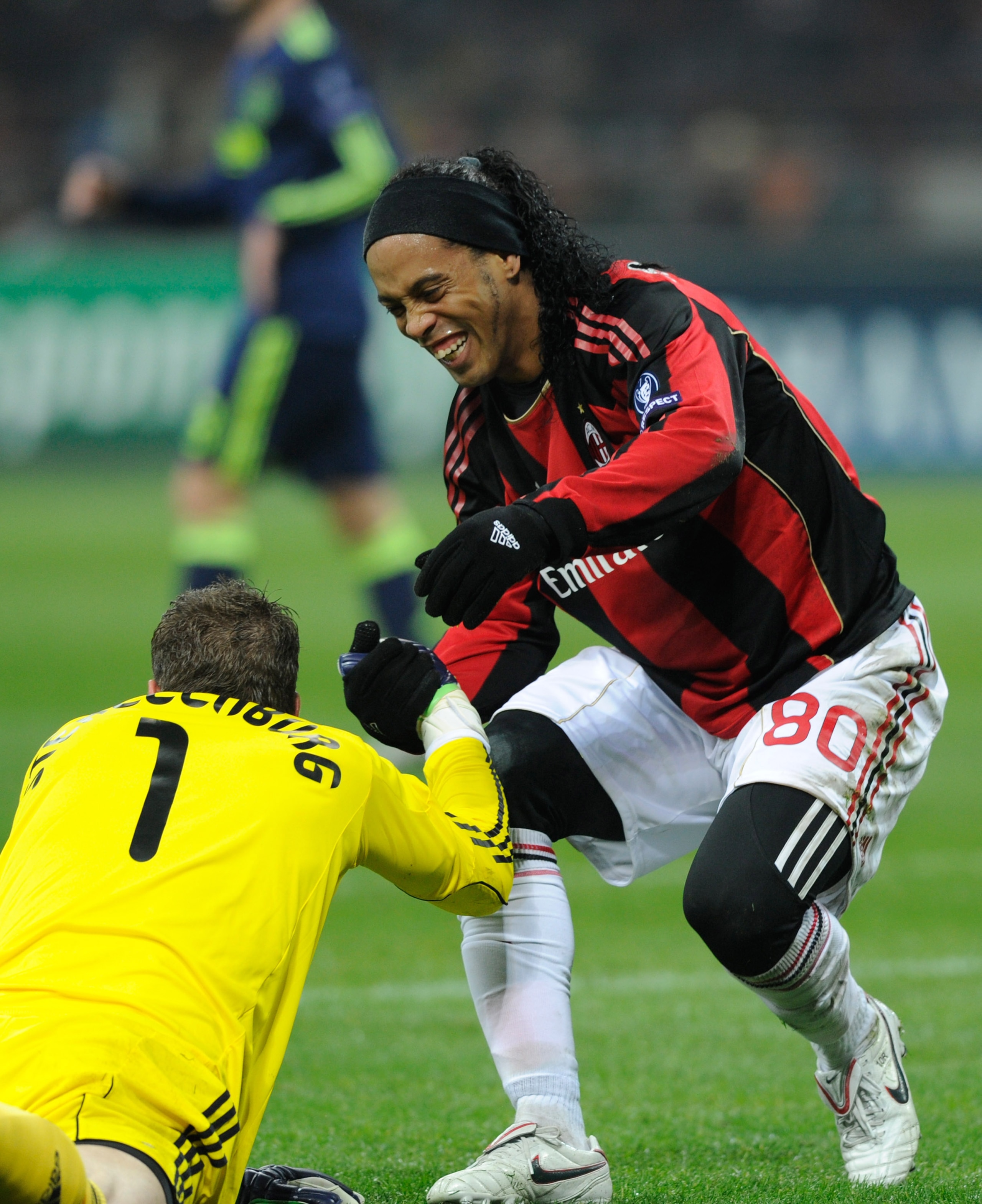 MILAN, ITALY - DECEMBER 08:  Maarten Stekelenburg of AFC Ajax is helped up by Ronaldinho of AC Milan during the UEFA Champions League Group G match between AC Milan and AFC Ajax at Stadio Giuseppe Meazza on December 8, 2010 in Milan, Italy.  (Photo by Cla