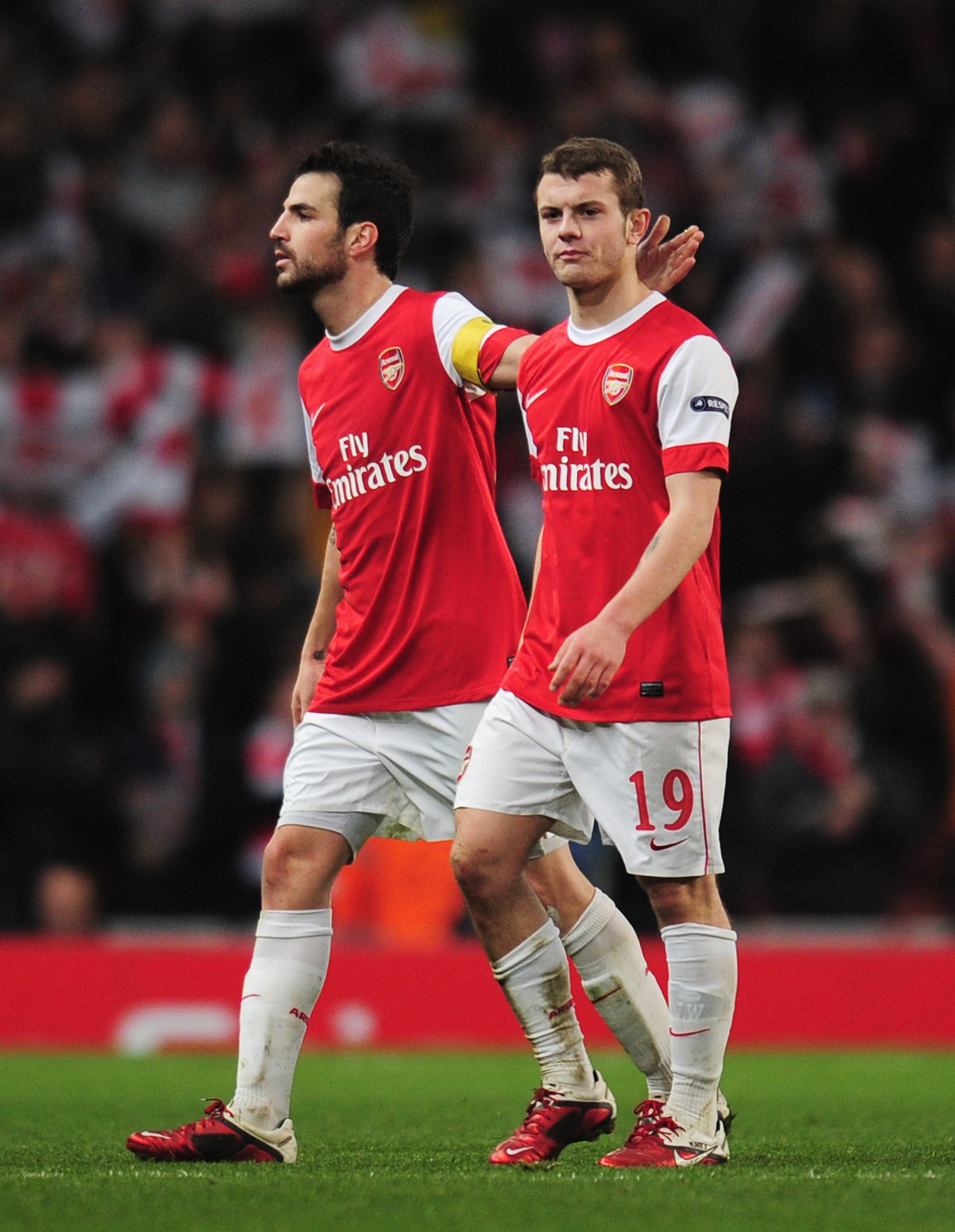 LONDON, ENGLAND - FEBRUARY 16:  Cesc Fabregas (L) of Arsenal congratulates Jack Wilshere after the UEFA Champions League round of 16 first leg match between Arsenal and Barcelona at the Emirates Stadium on February 16, 2011 in London, England.  (Photo by