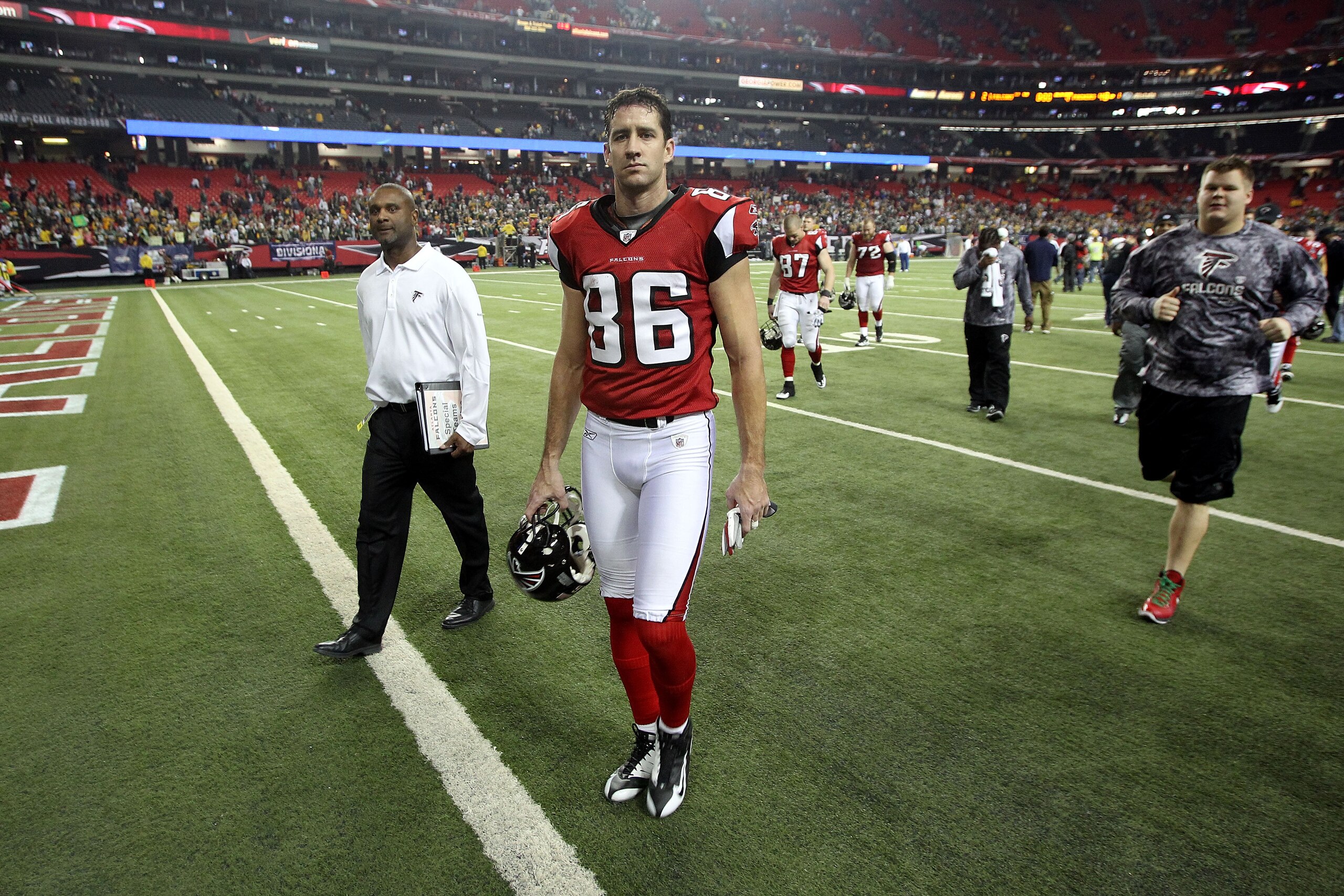 ATLANTA, GA - JANUARY 15:  Brian Finneran #86 of the Atlanta Falcons walks off the field after they lost 48-21 against the Green Bay Packers during their 2011 NFC divisional playoff game at Georgia Dome on January 15, 2011 in Atlanta, Georgia.  (Photo by